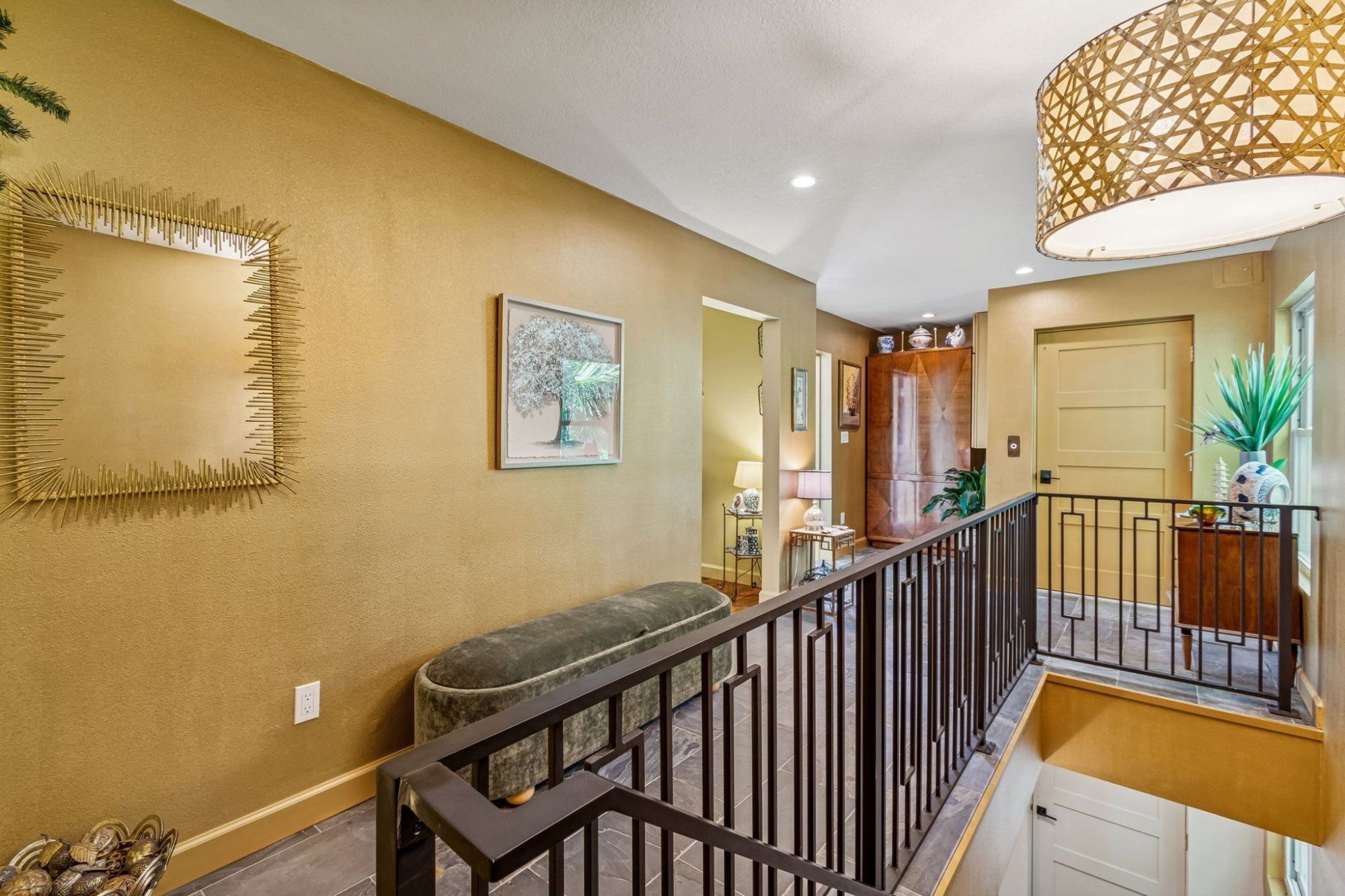 Interior upper level landing gold accent wall iron railing — Custom home addition, Longboat Key