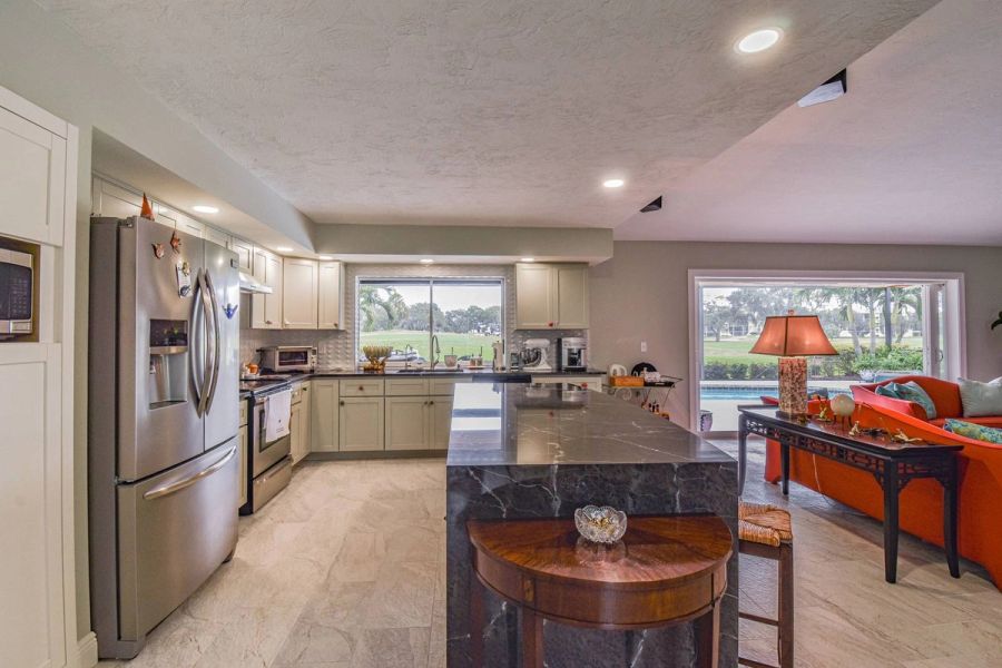 Kitchen golf course view — Custom design-build near IMG Academy, West Bradenton