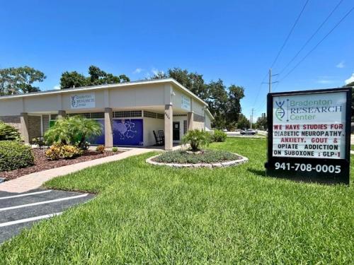 Bradenton Research Center building and roadside sign across the front lawn