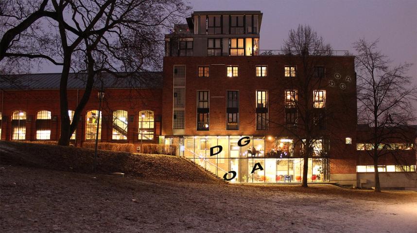 A photo of the DOGA building with the DOGA logo on the facade.