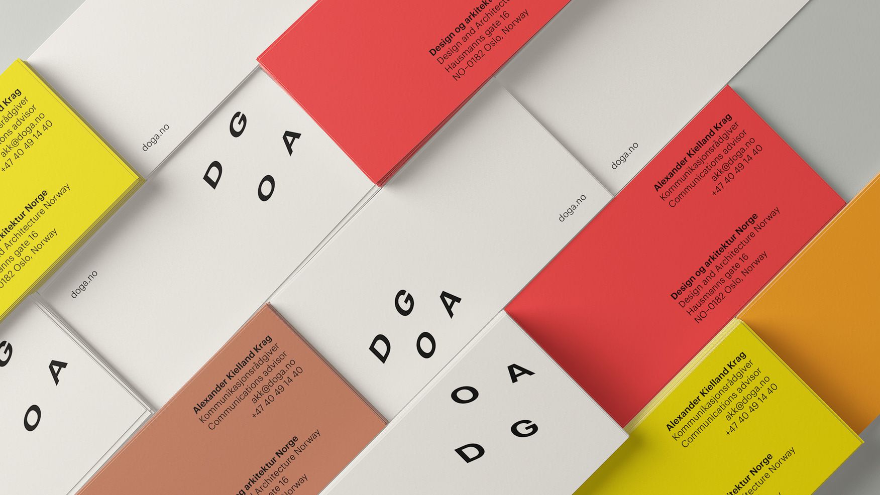 An example of DOGA business cards, with the DOGA colours and font.