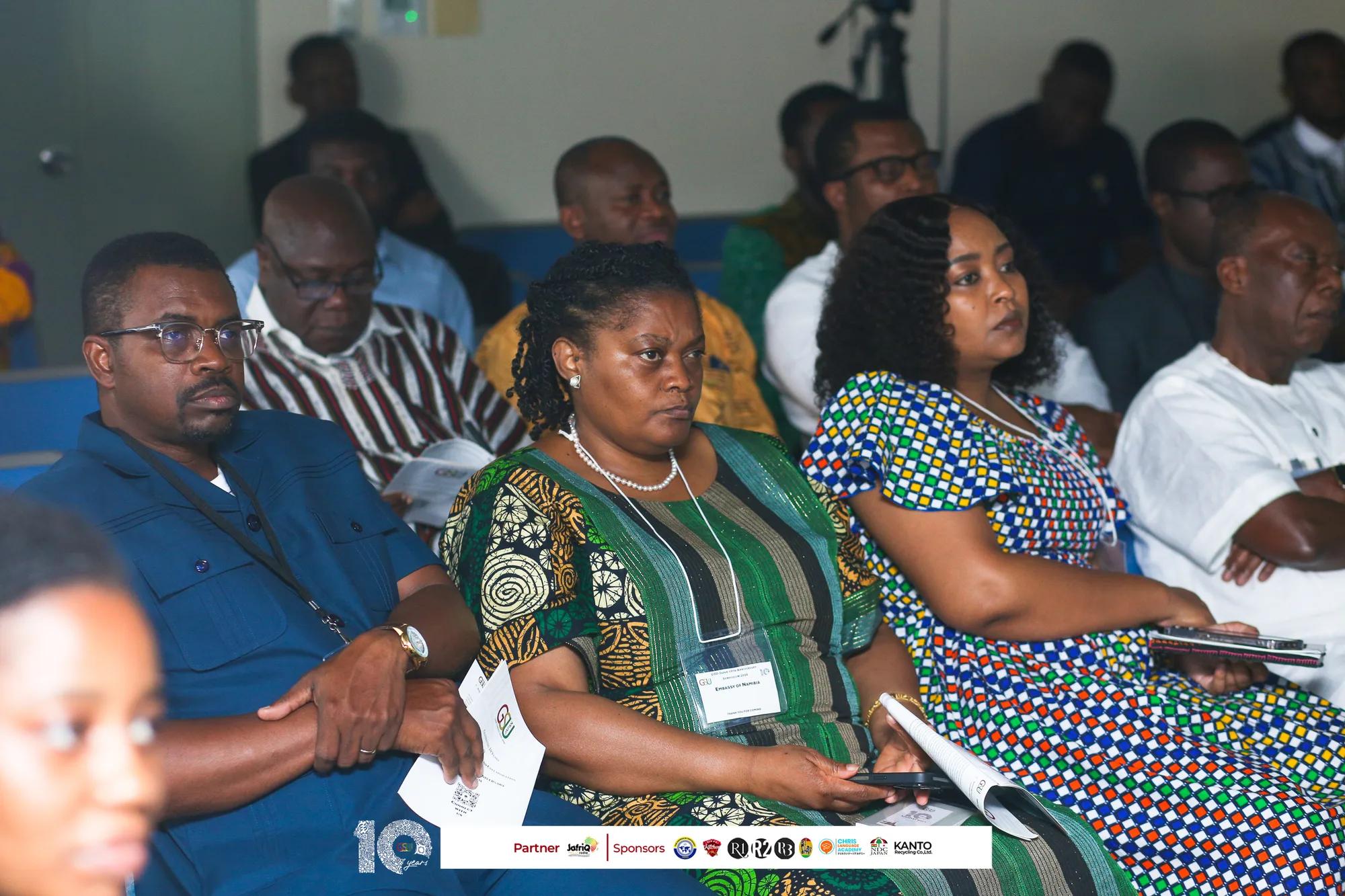 Audience members follow the talks closely with programmes in hand