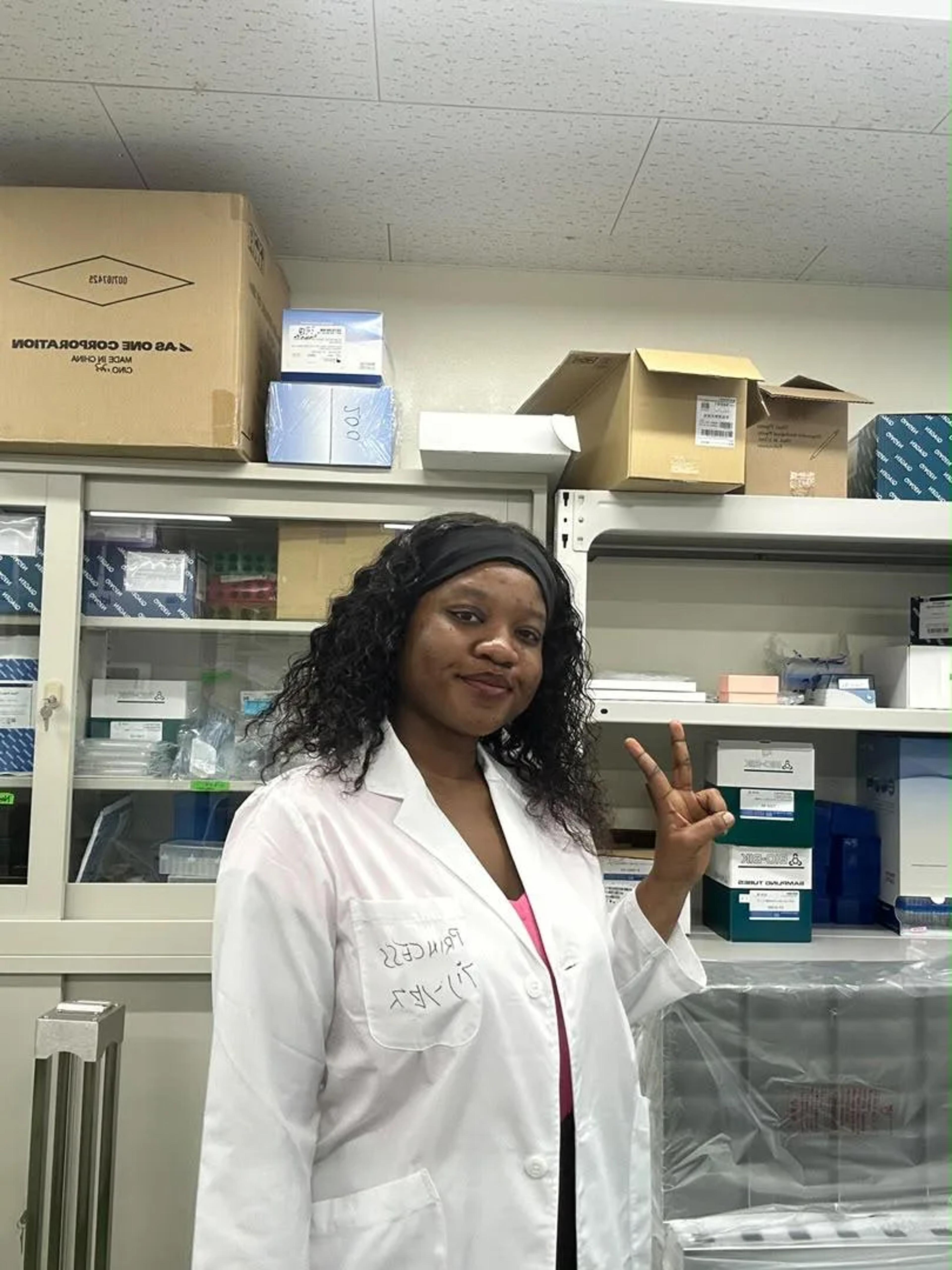 Princess Martey in her lab coat at Nagasaki University