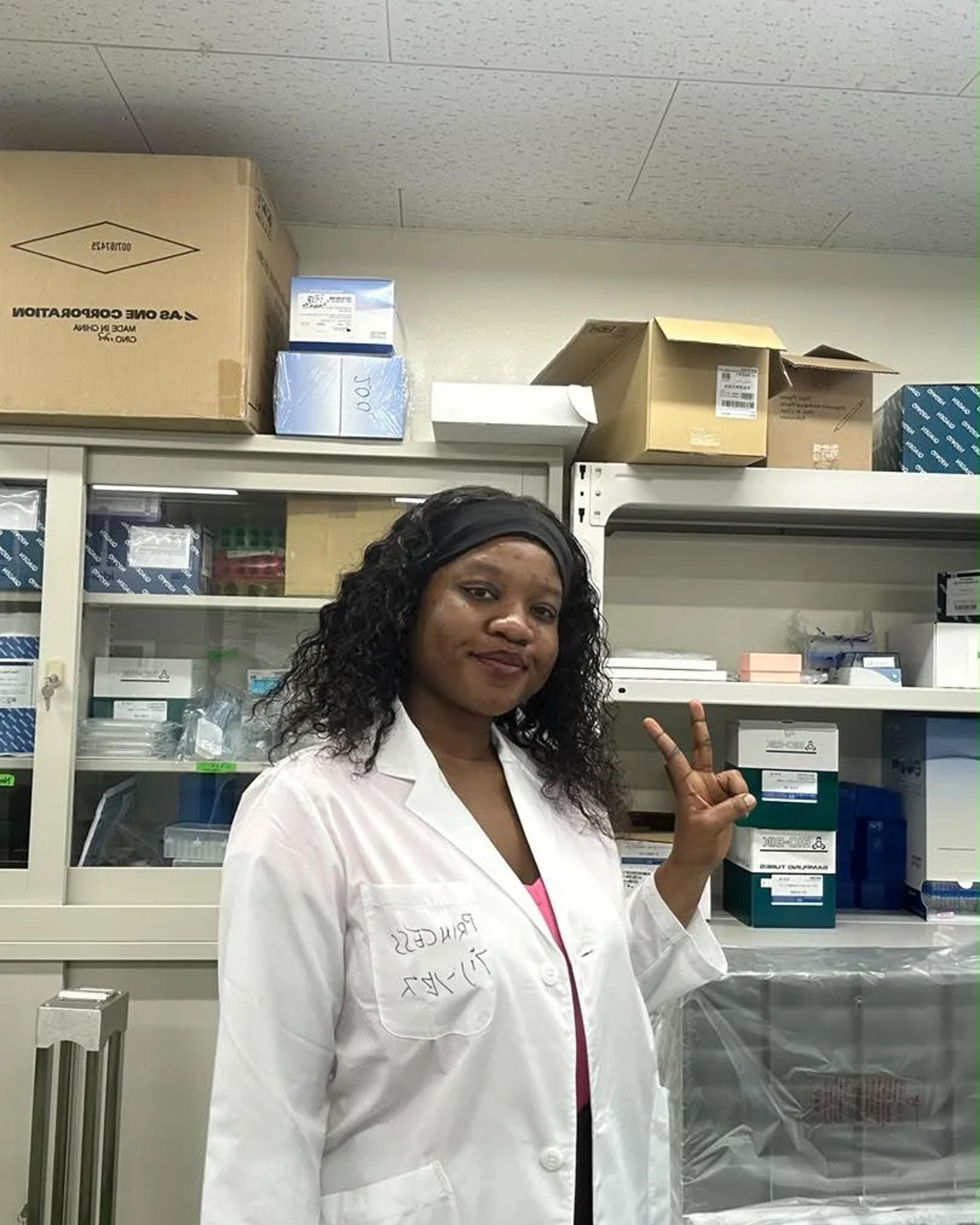 Princess Martey in her lab coat at Nagasaki University