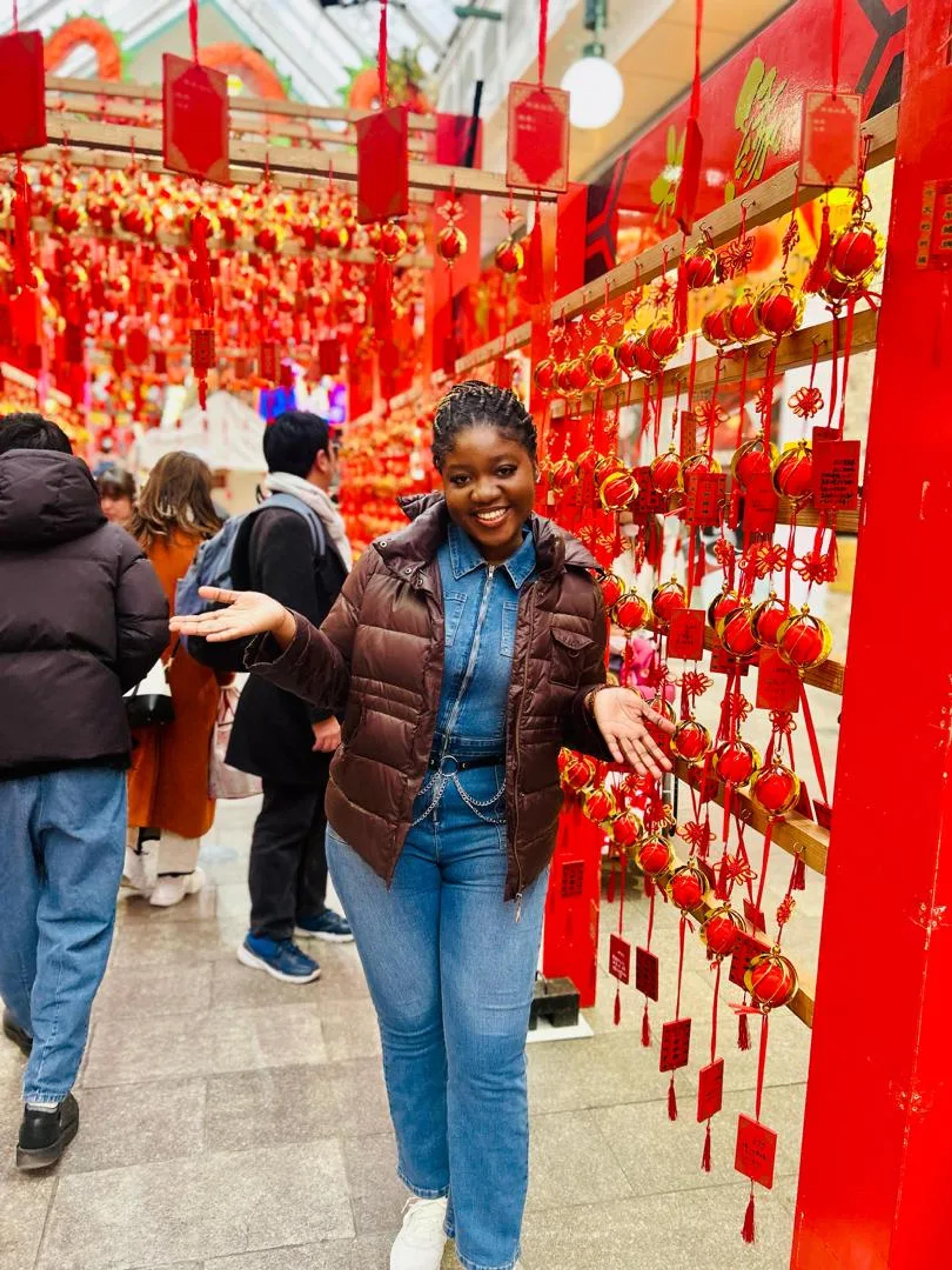 Princess Martey smiling among red lanterns in Nagasaki