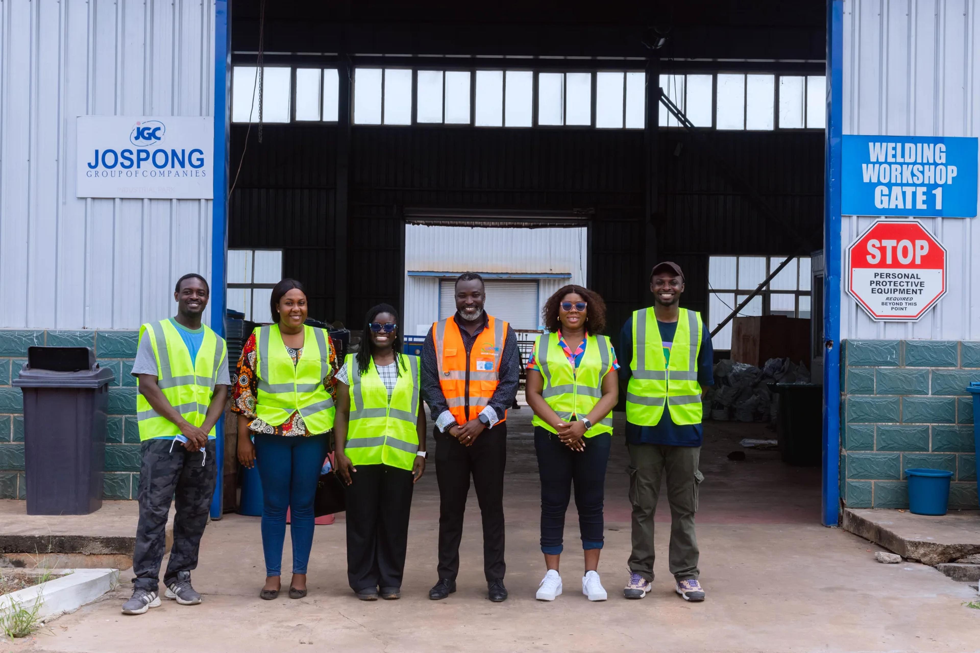 The team and staff at a Jospong workshop gate