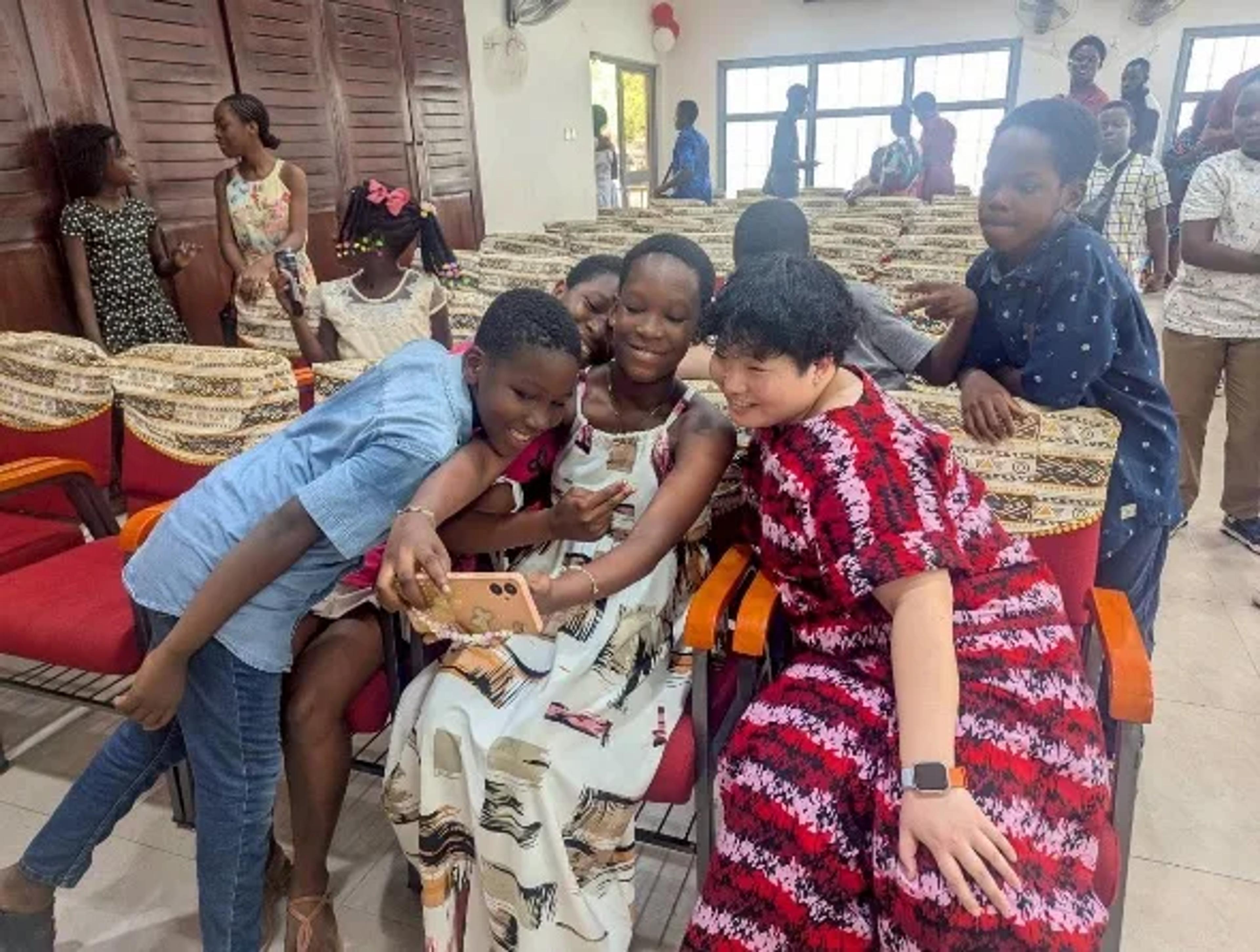 Nanami with children in Ghana