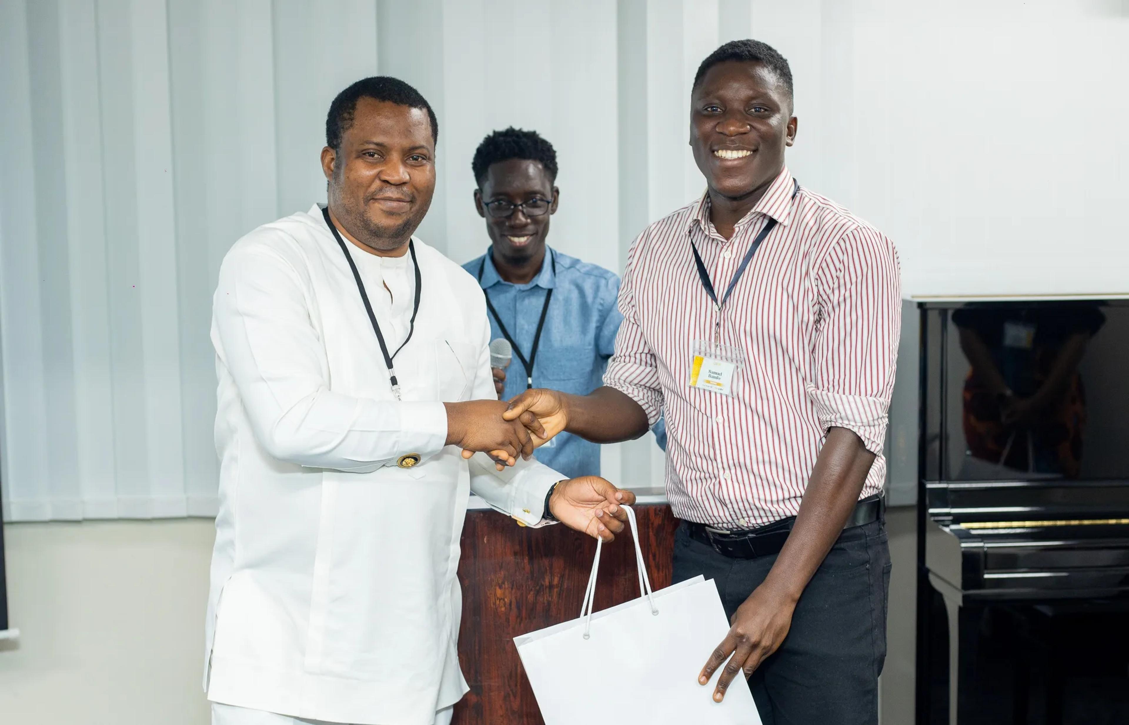 Samuel Bamfo Bredu receiving an award at the 10th Anniversary Symposium