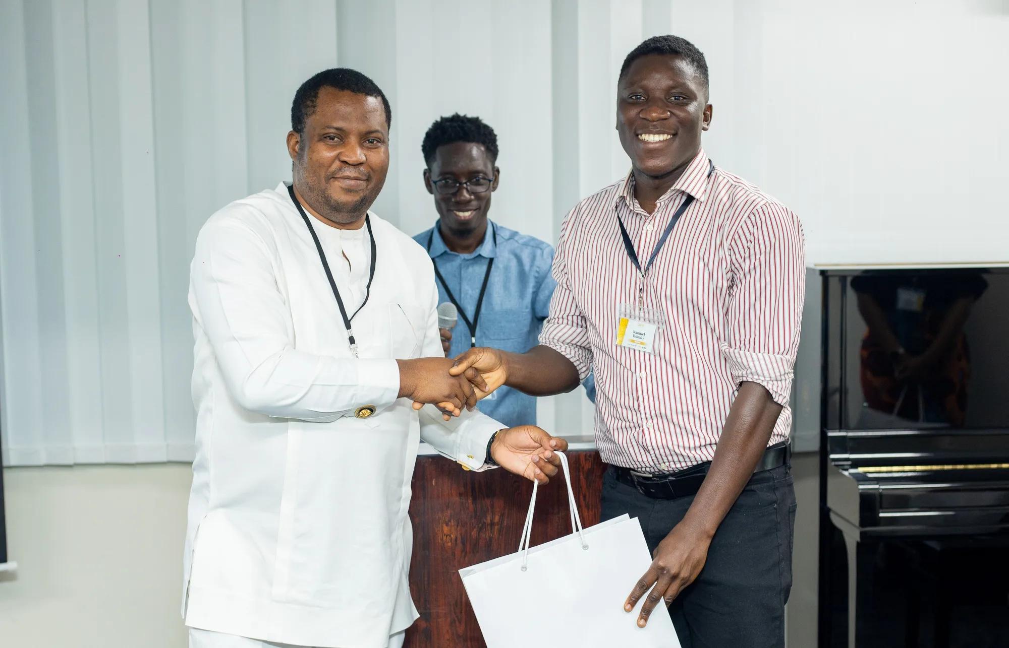 Samuel Bamfo Bredu receiving an award at the 10th Anniversary Symposium