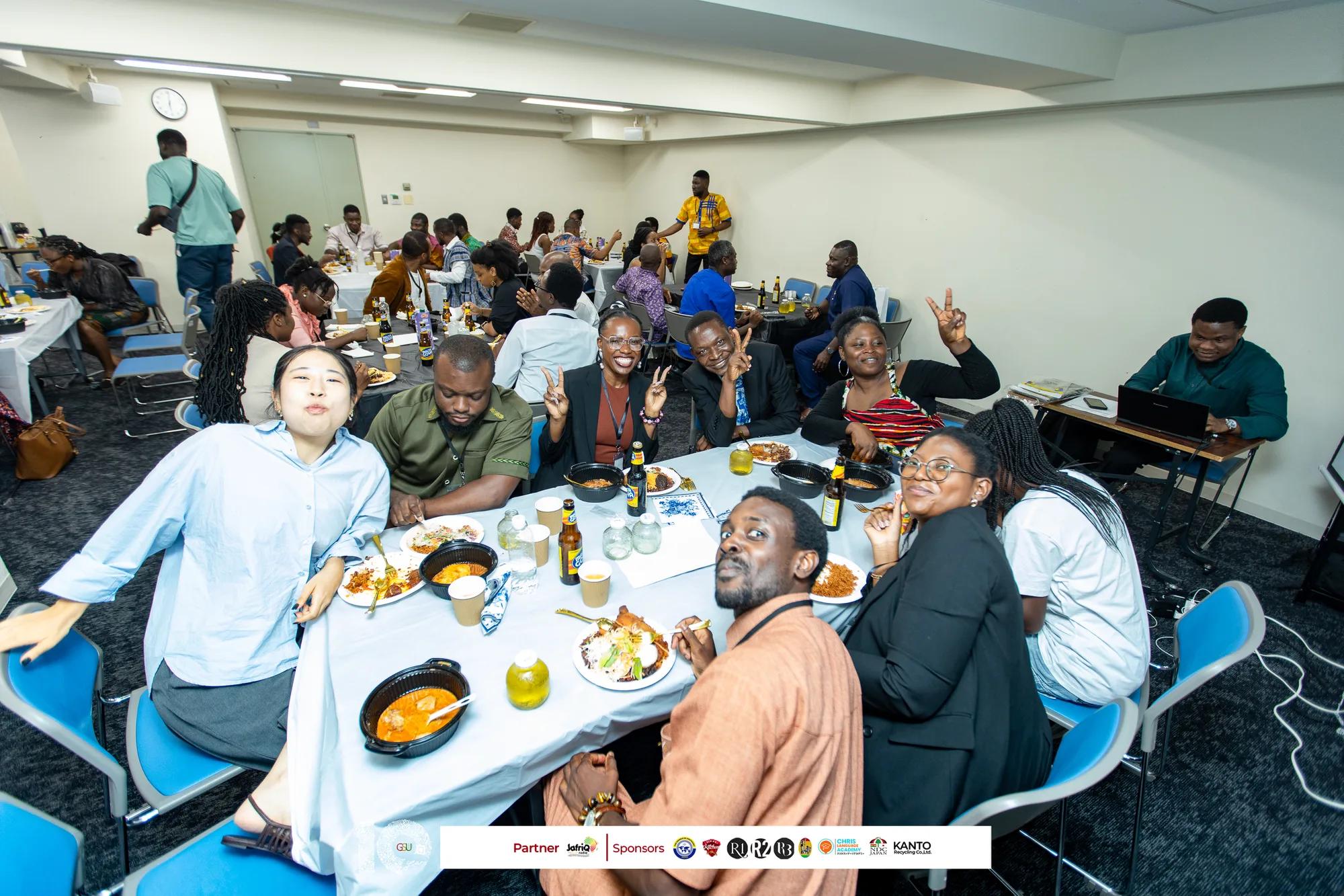 Guests share a meal and conversation at the anniversary dinner tables