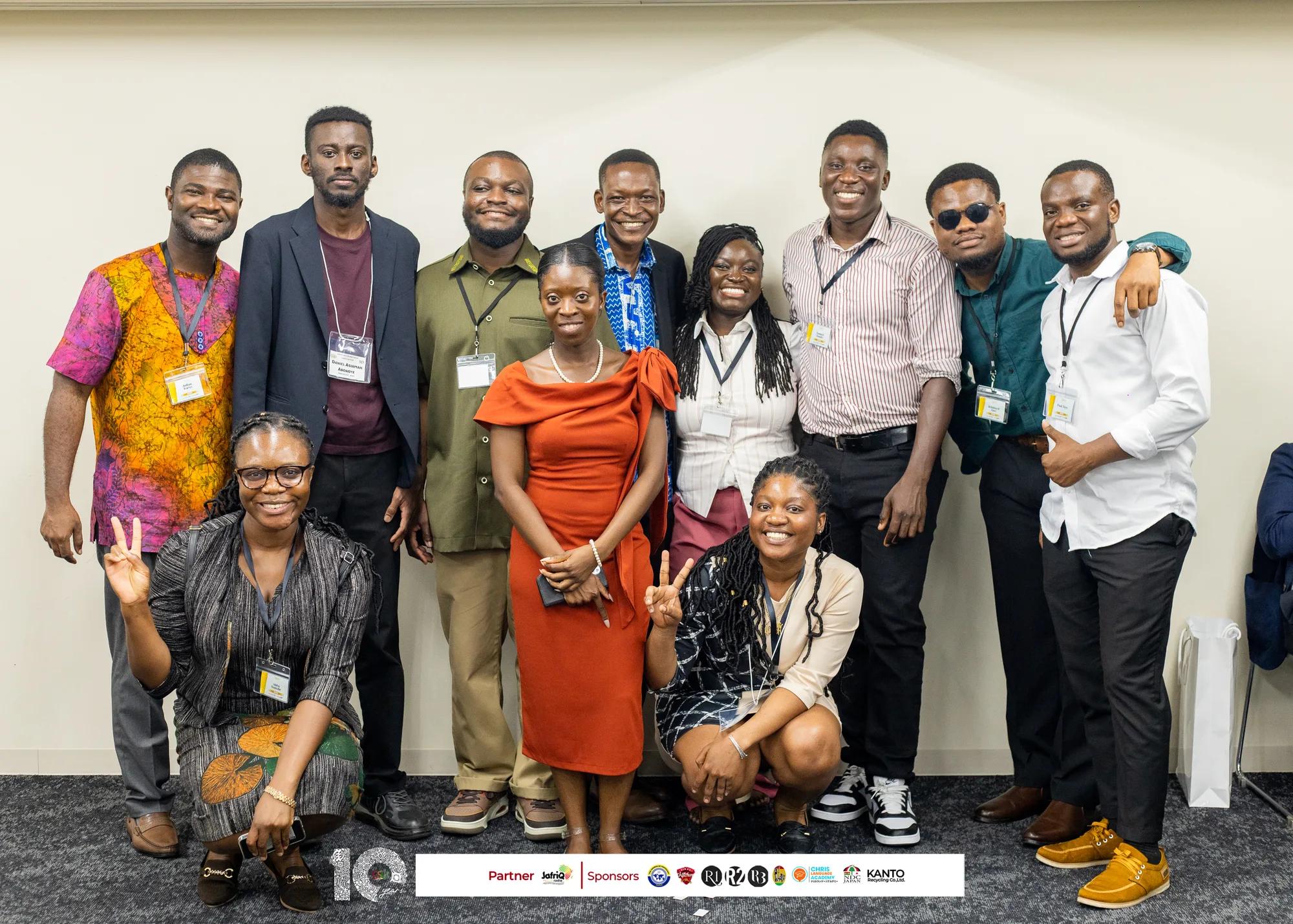 Young members pose for a cheerful group photo after the symposium