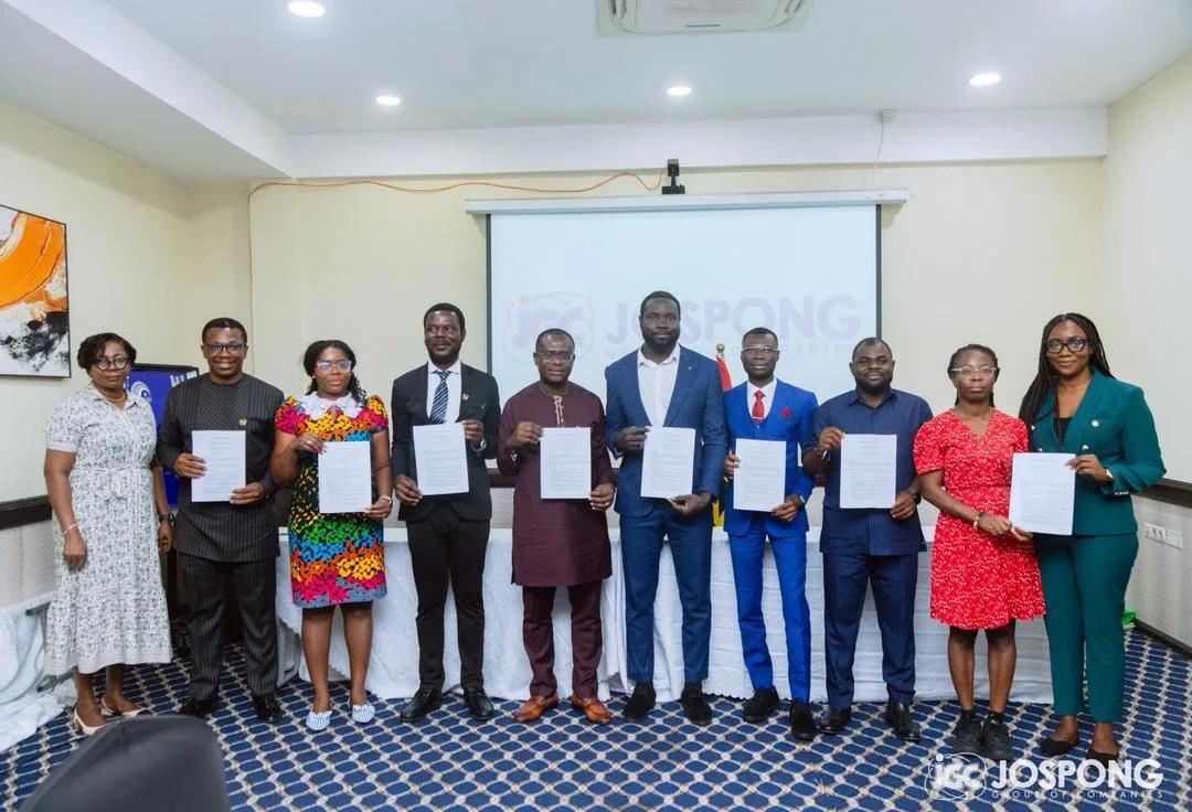 Signatories holding the signed memorandum of understanding at the Jospong Group event in Accra