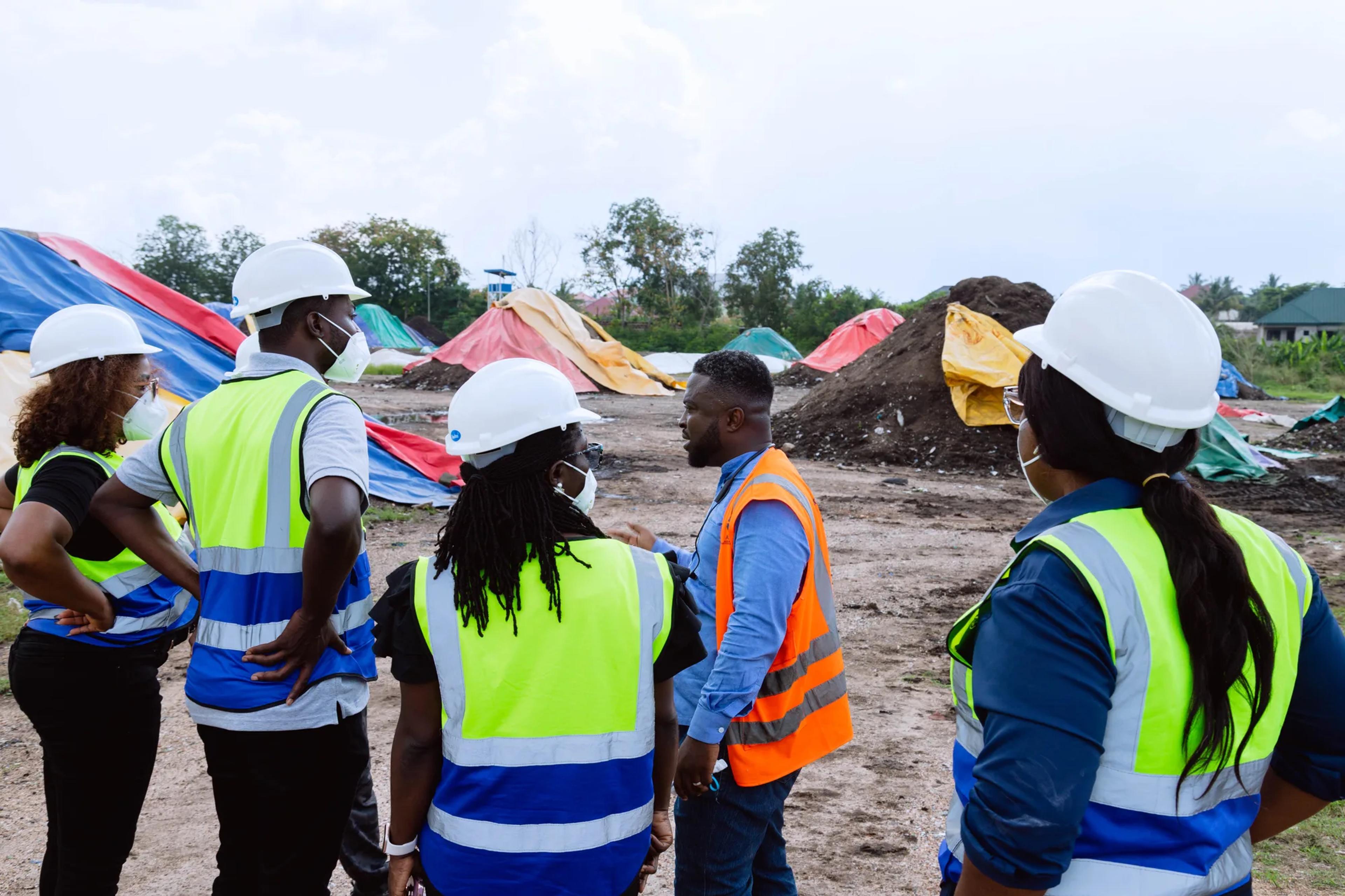 The team walking through the compost yard