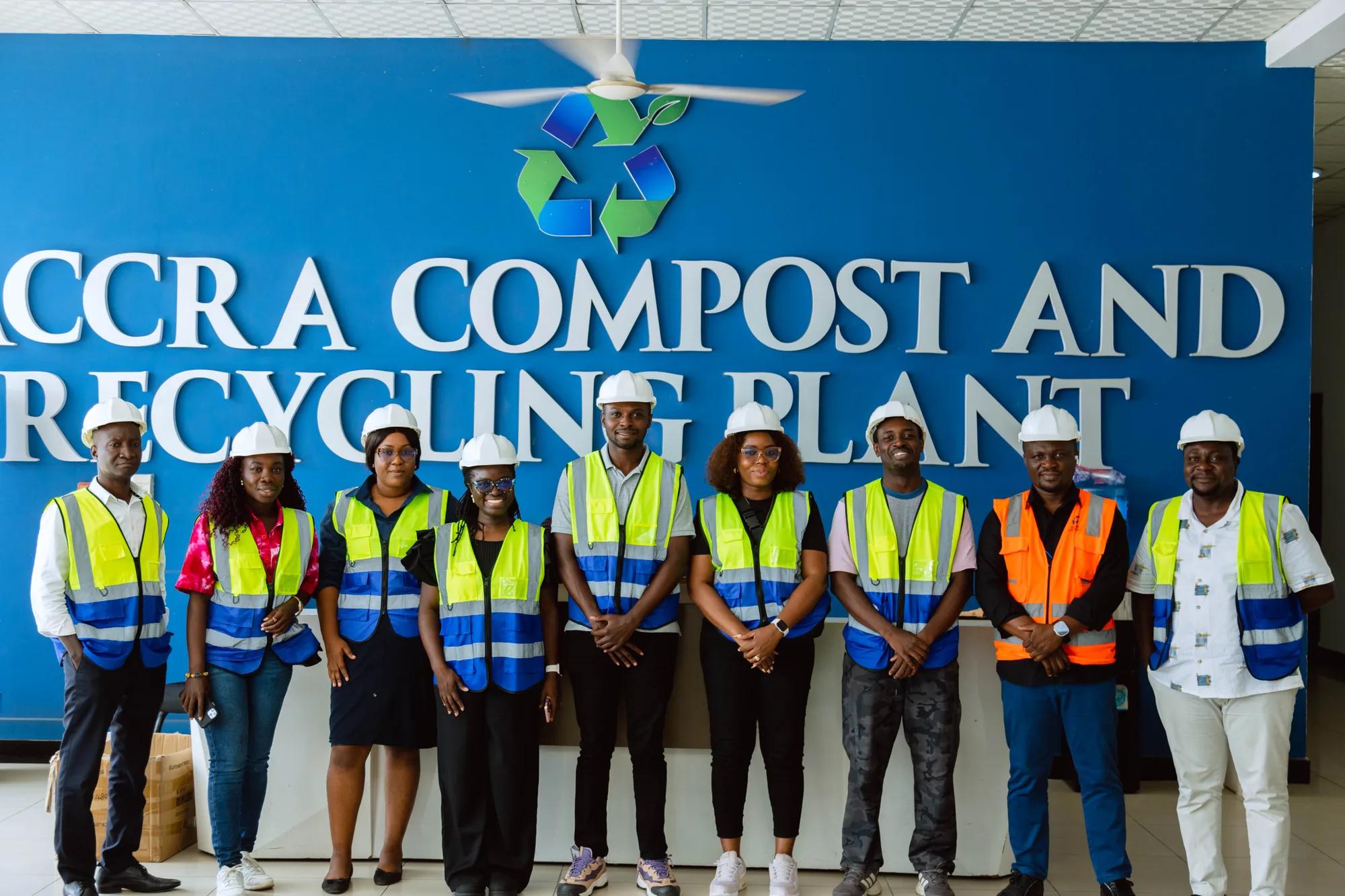 The GSU-Japan team and staff in front of the Accra Compost and Recycling Plant sign