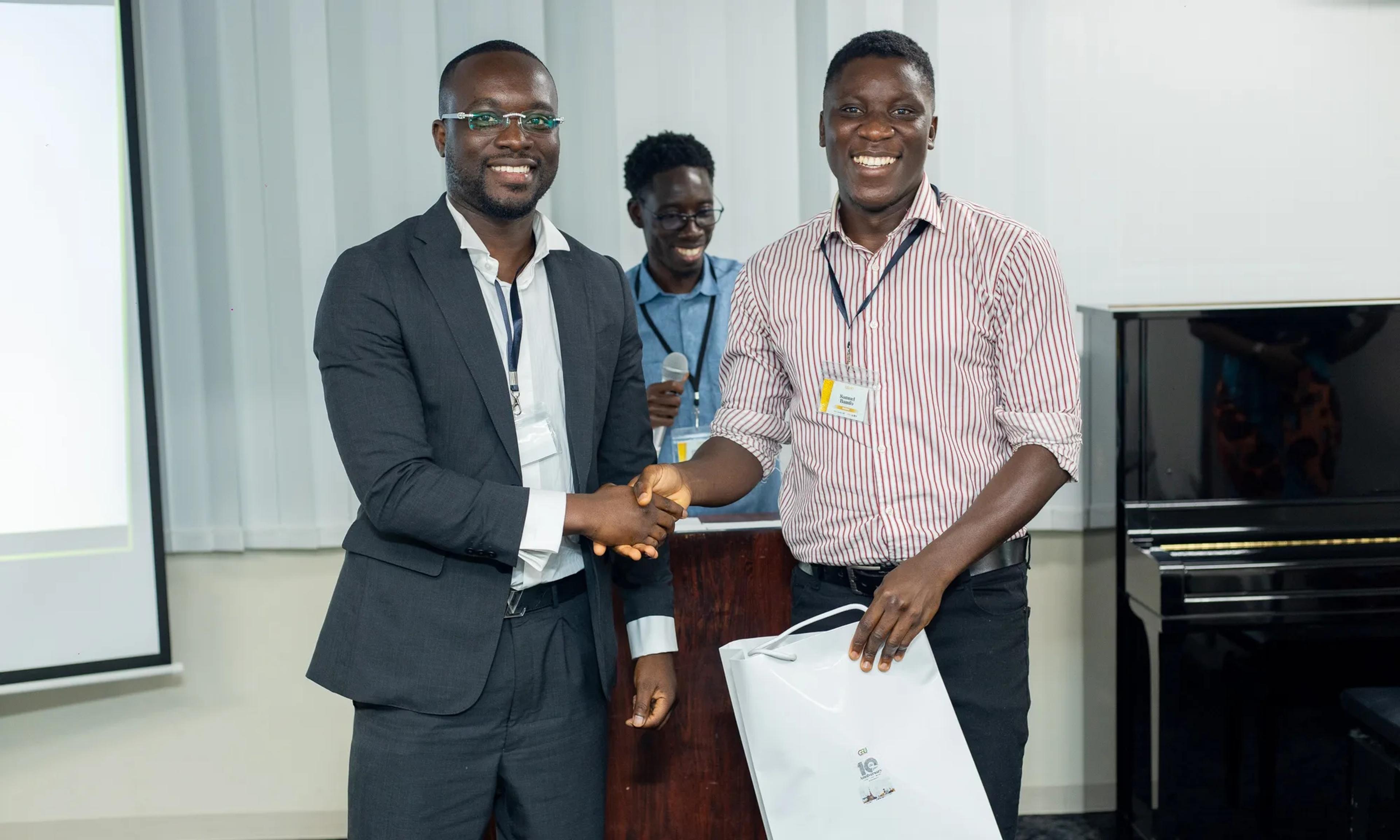 Samuel Bamfo Bredu receiving his second award at the 10th Anniversary Symposium