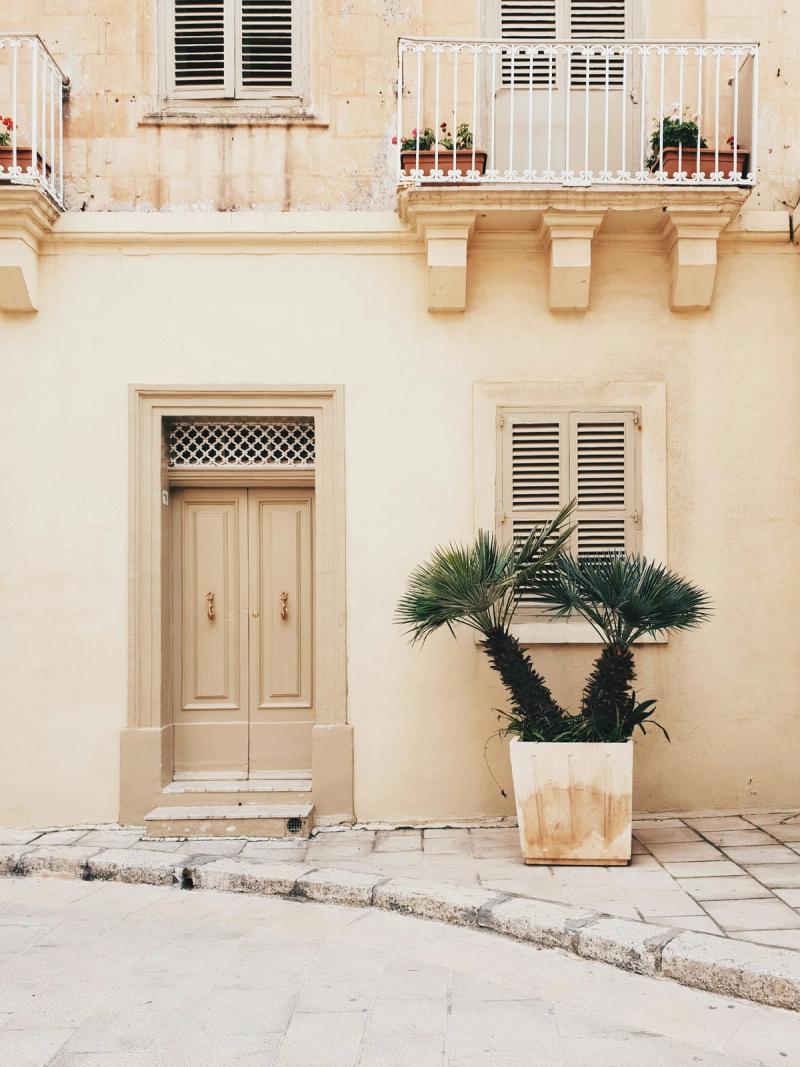 A quiet limestone street in Mdina