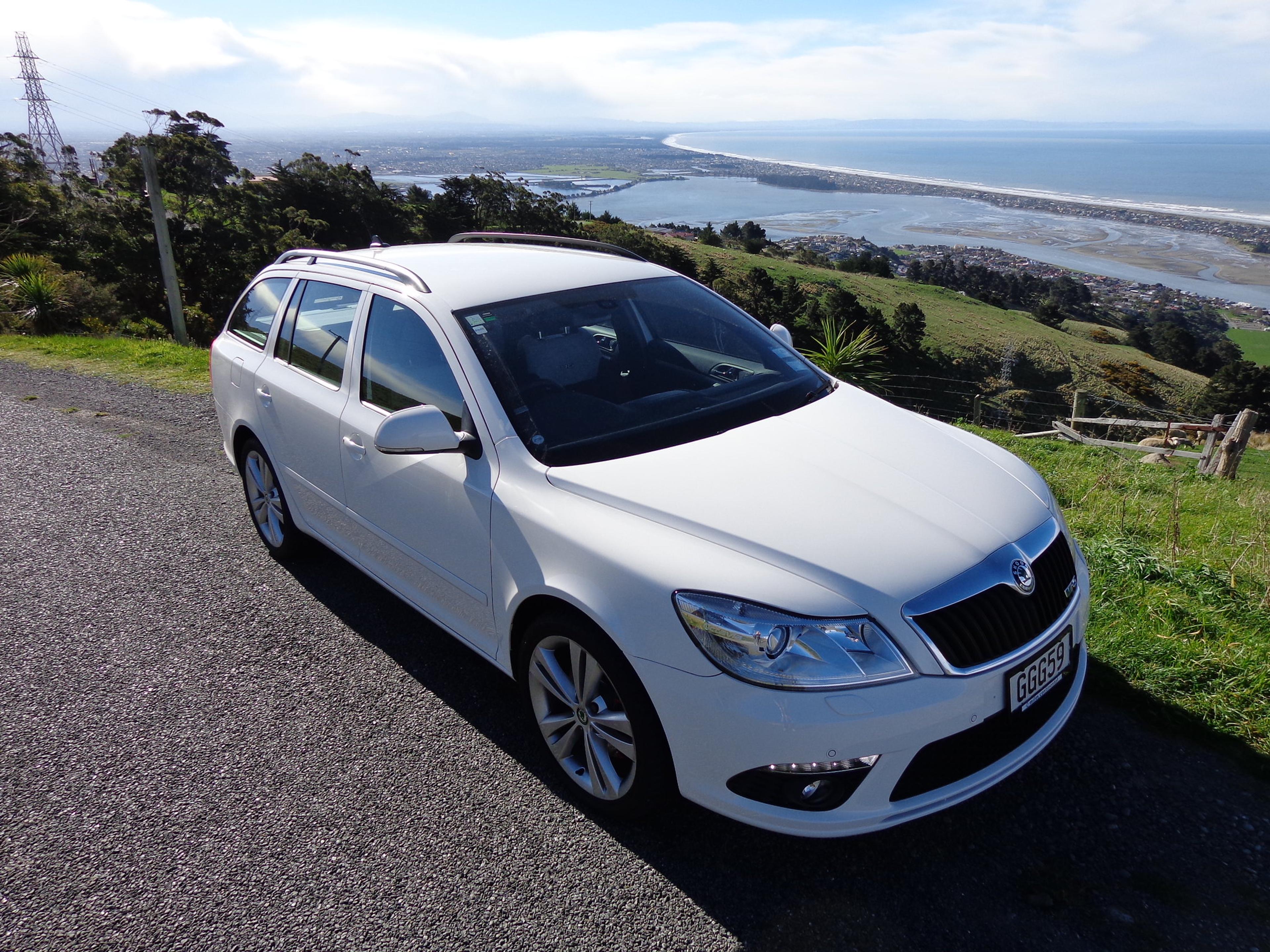 A white Škoda Octavia Estate on a hill  