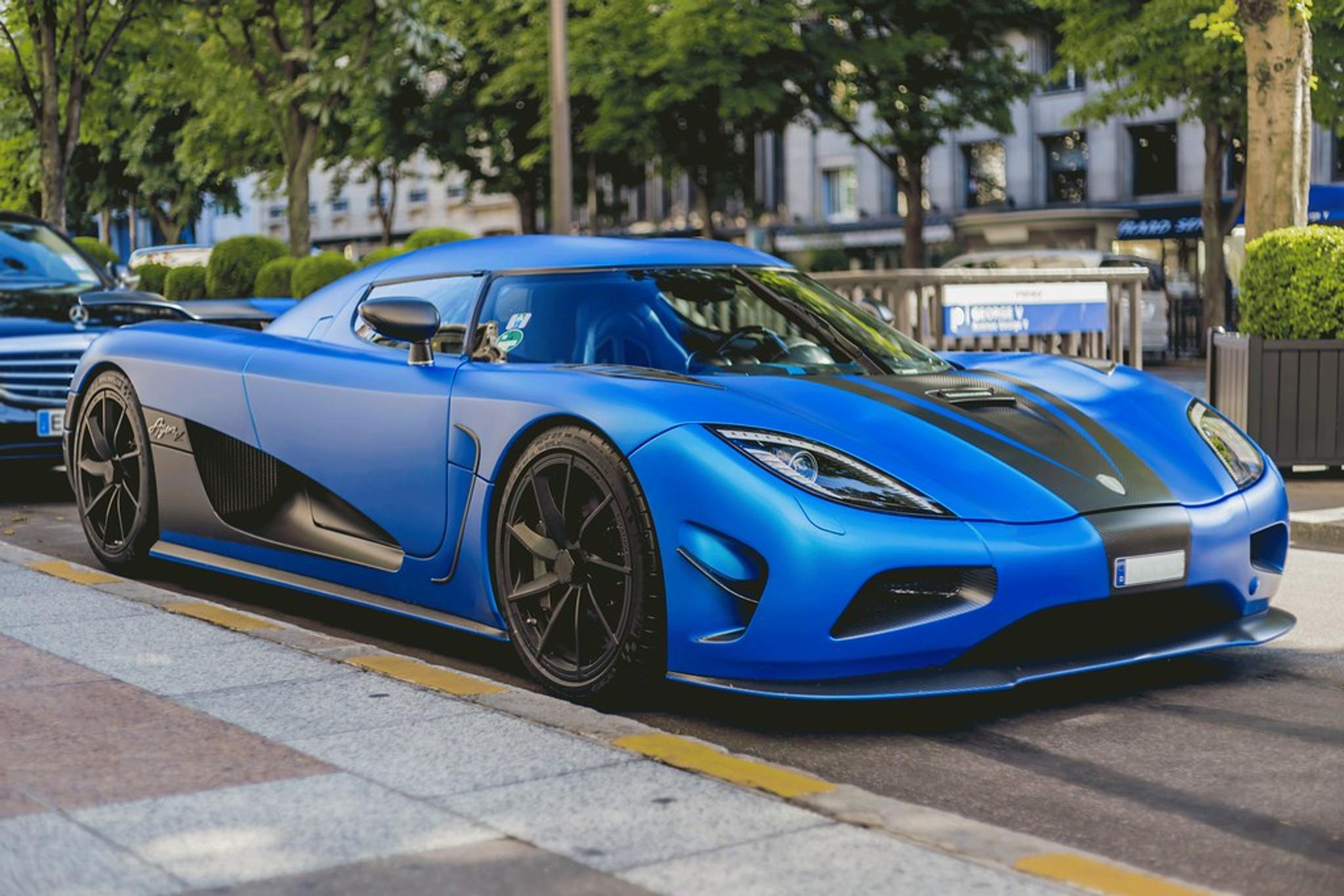 Blue Koenigsegg Agera R parked by the side of the road