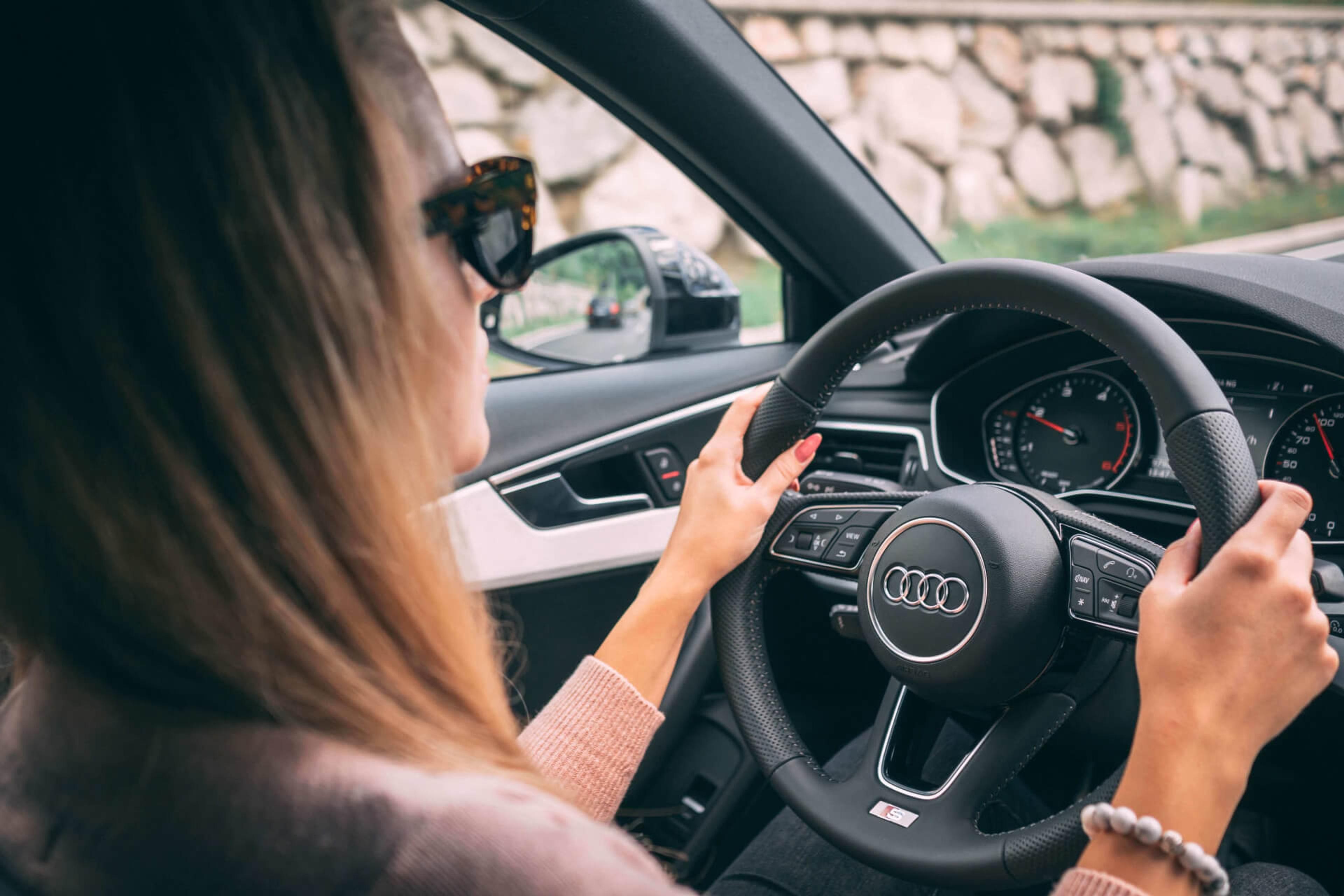 Woman driving an Audi