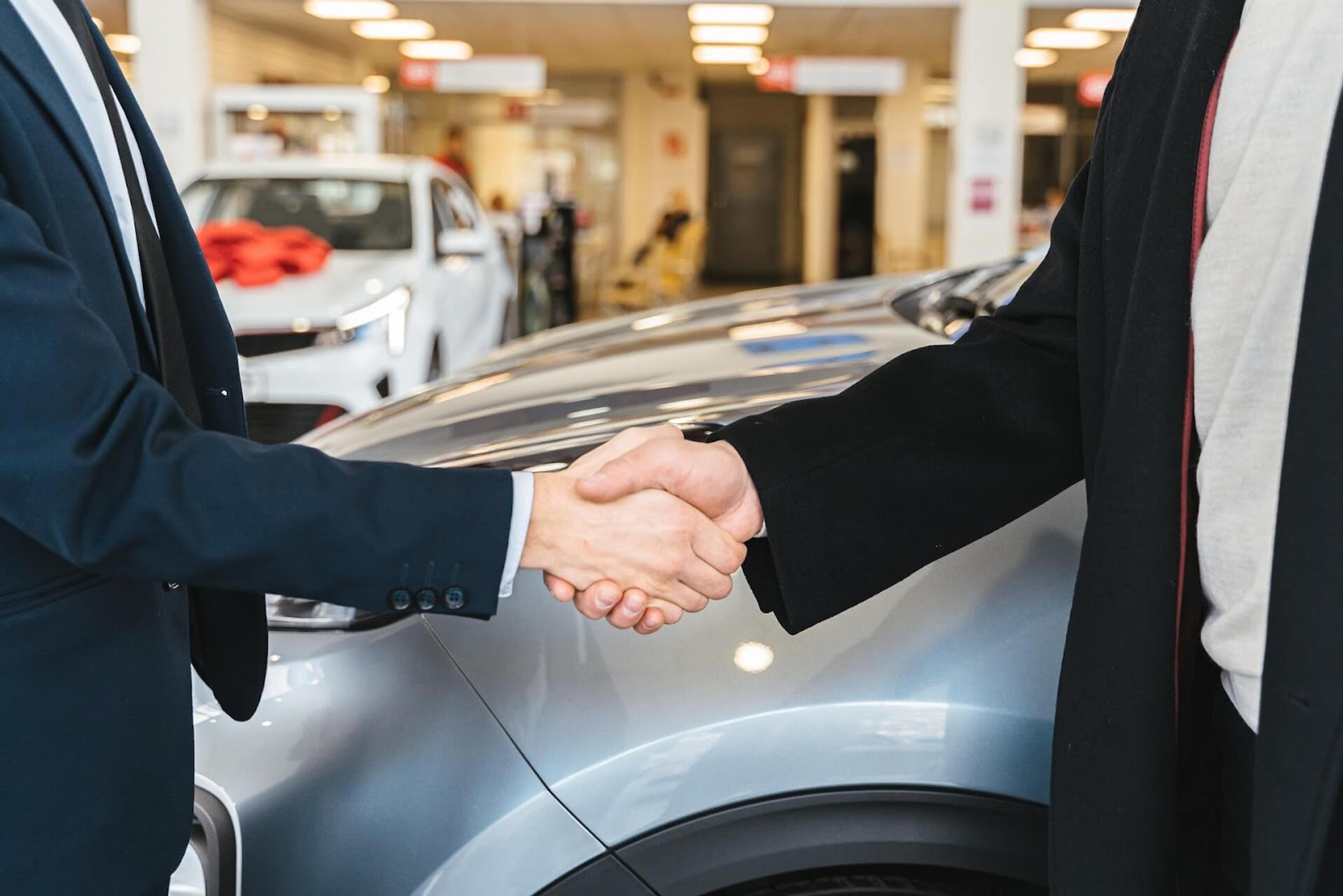deal, handshake, buying a car, car salon, purchasing a vehicle