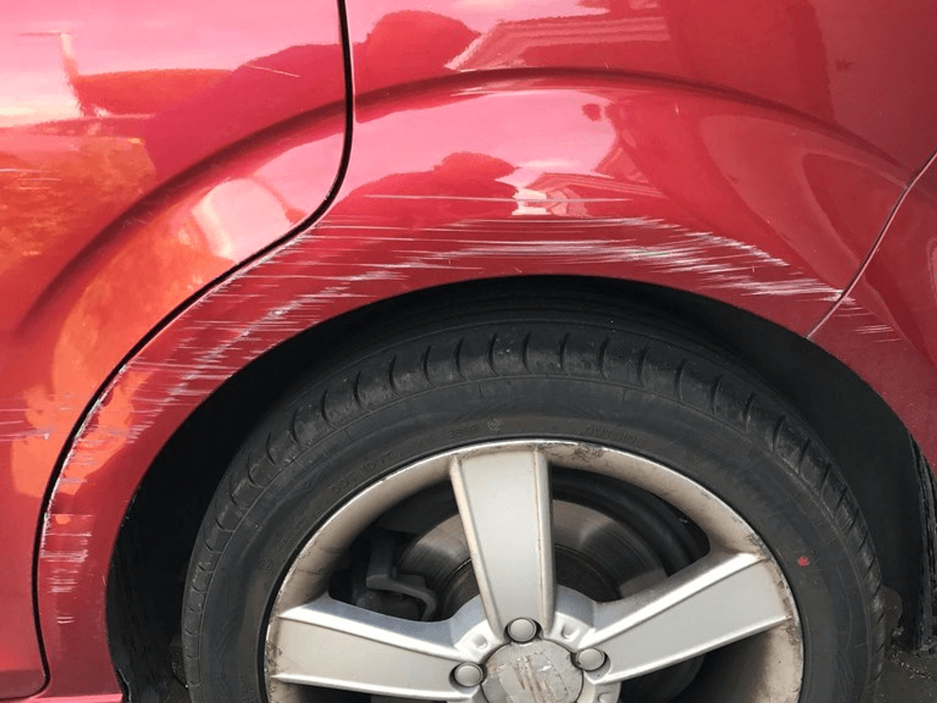 Scratches of red car side 