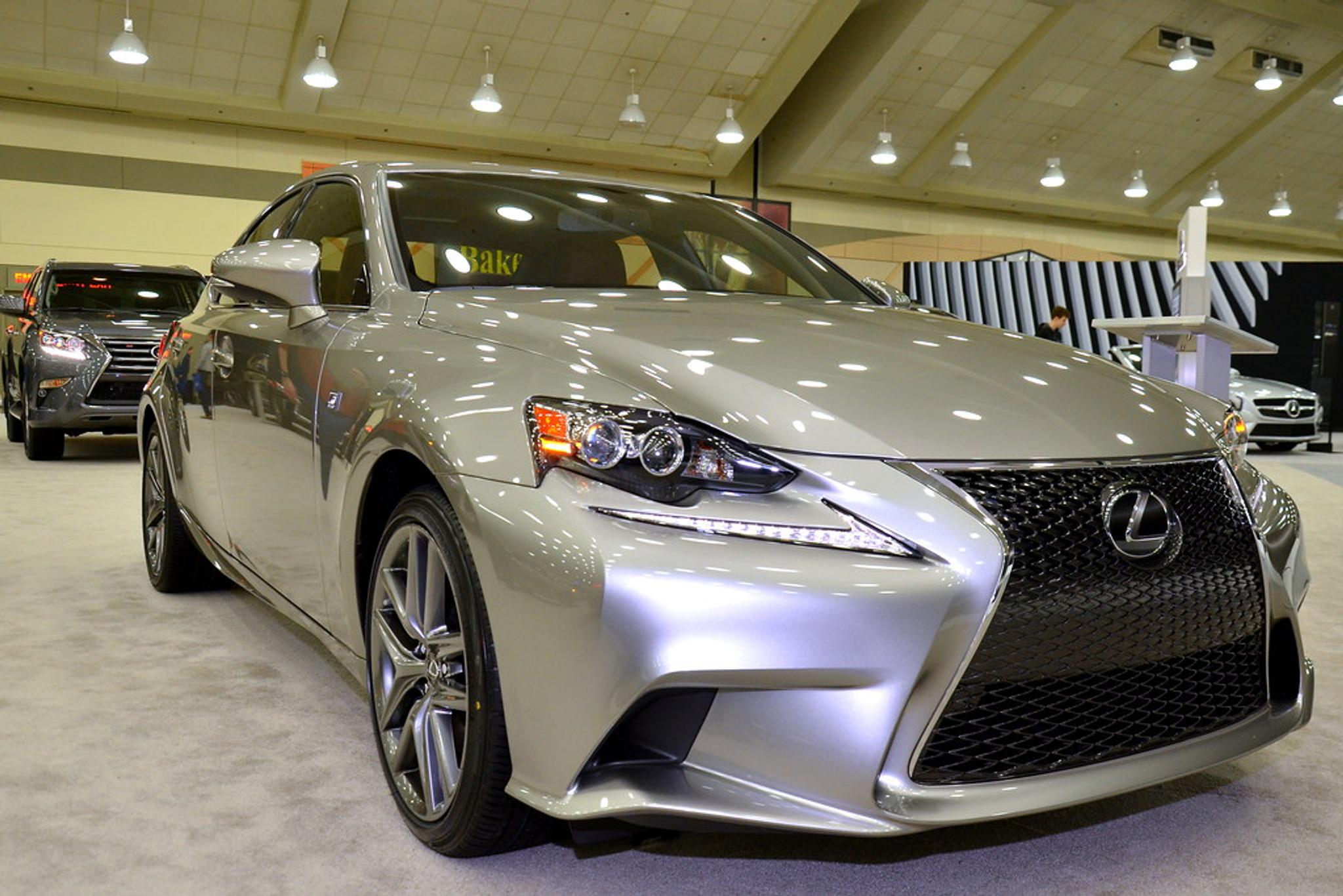 Silver Lexus IS in a showroom