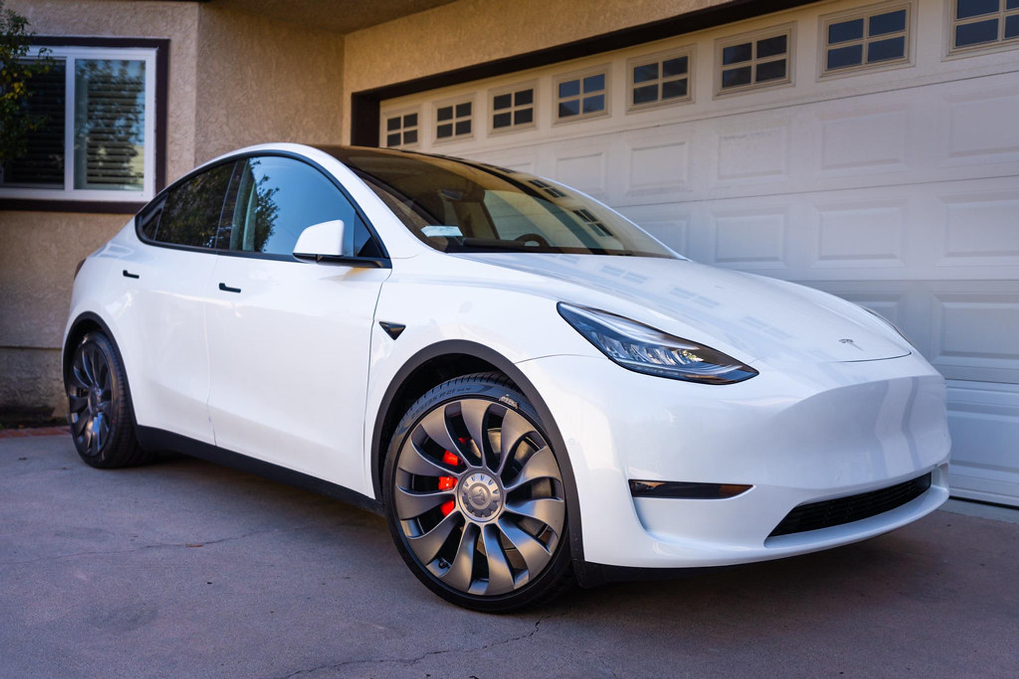 White Tesla Model Y with grey rims