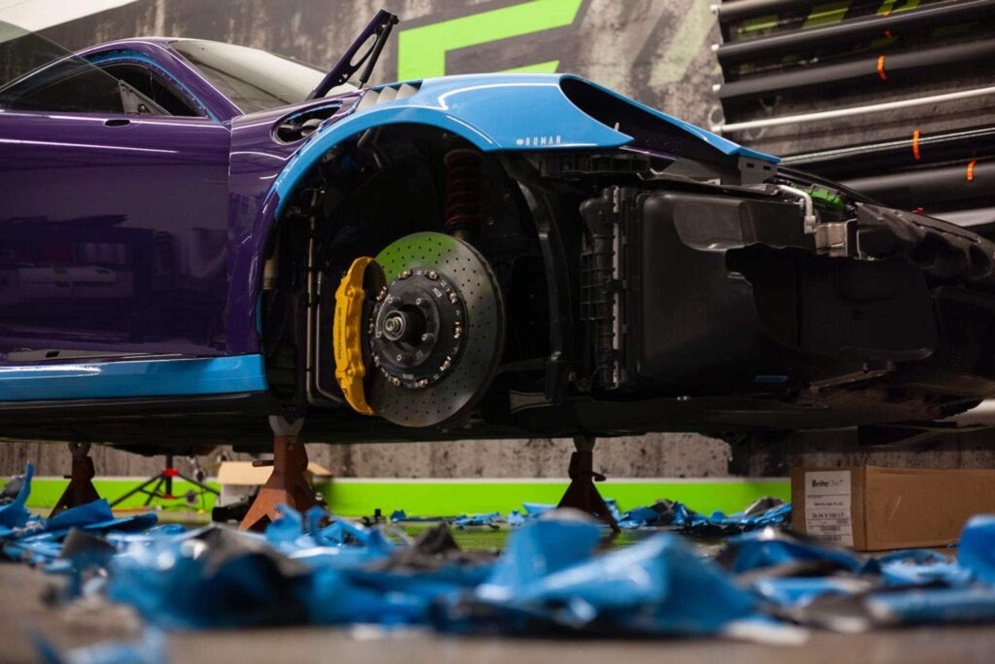 Removing blue PPF of purple Porsche 911