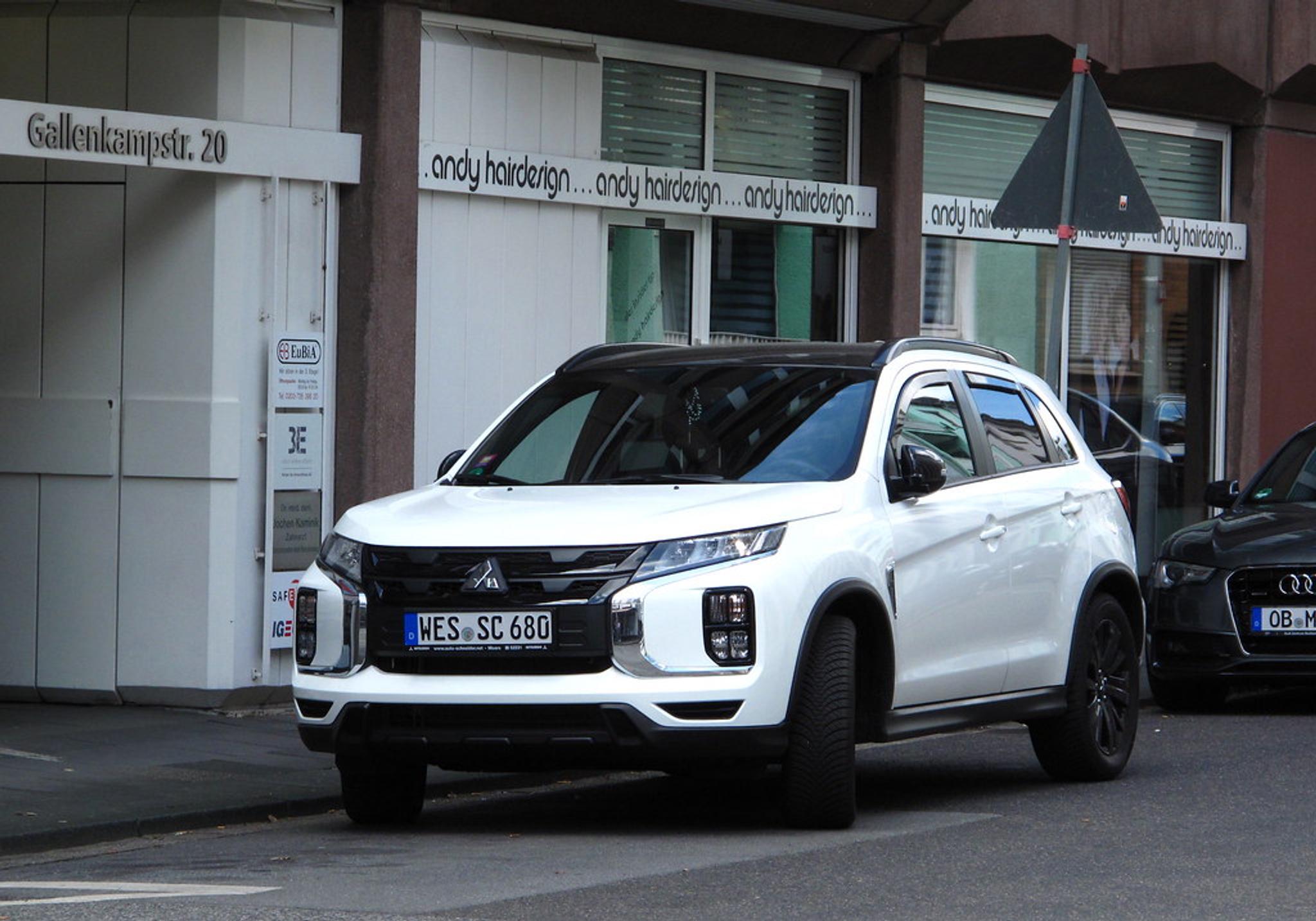 White Mitsubishi Outlander Sport (ASX) parked by the side of the road