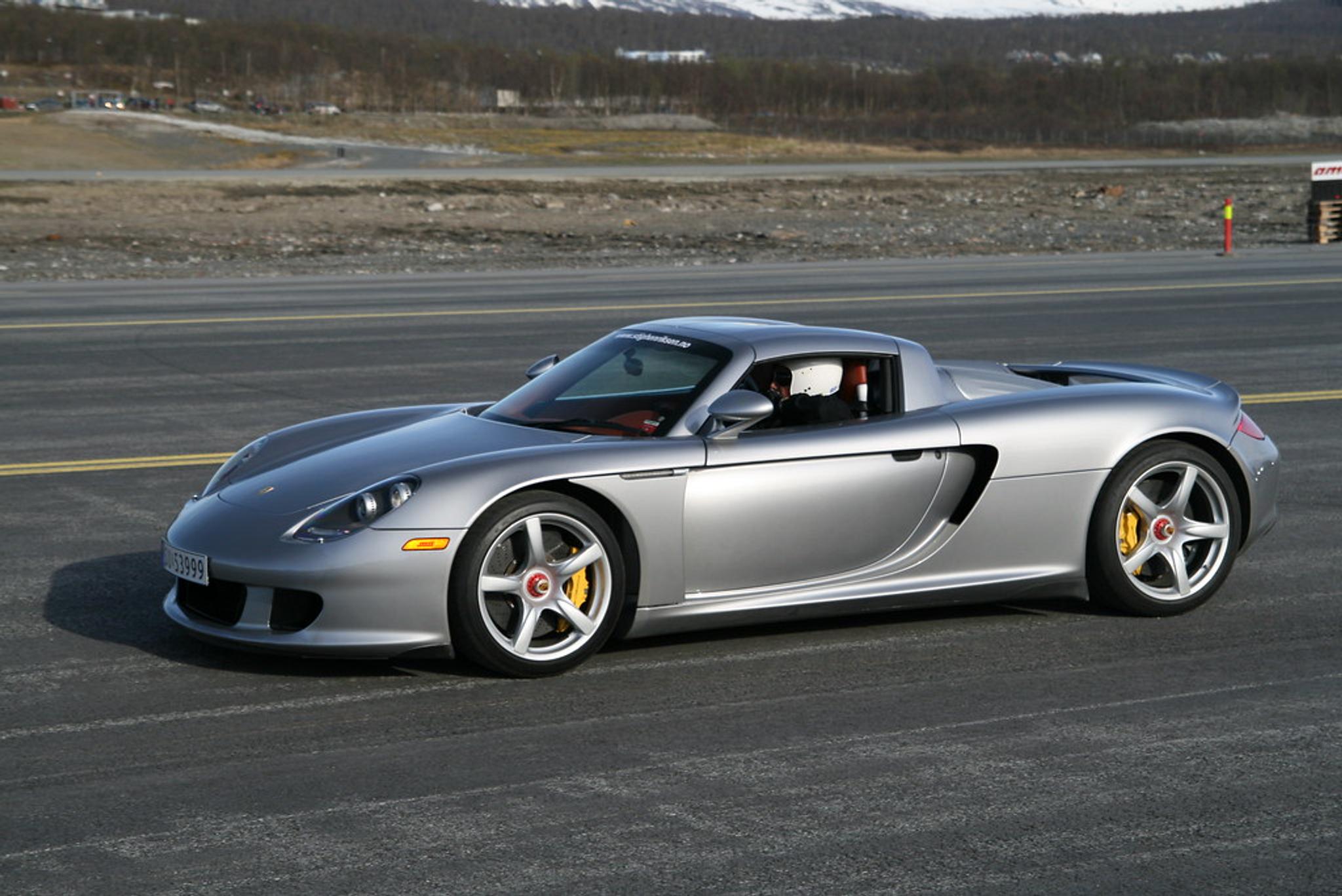 Silver Porsche Carrera GT on the track