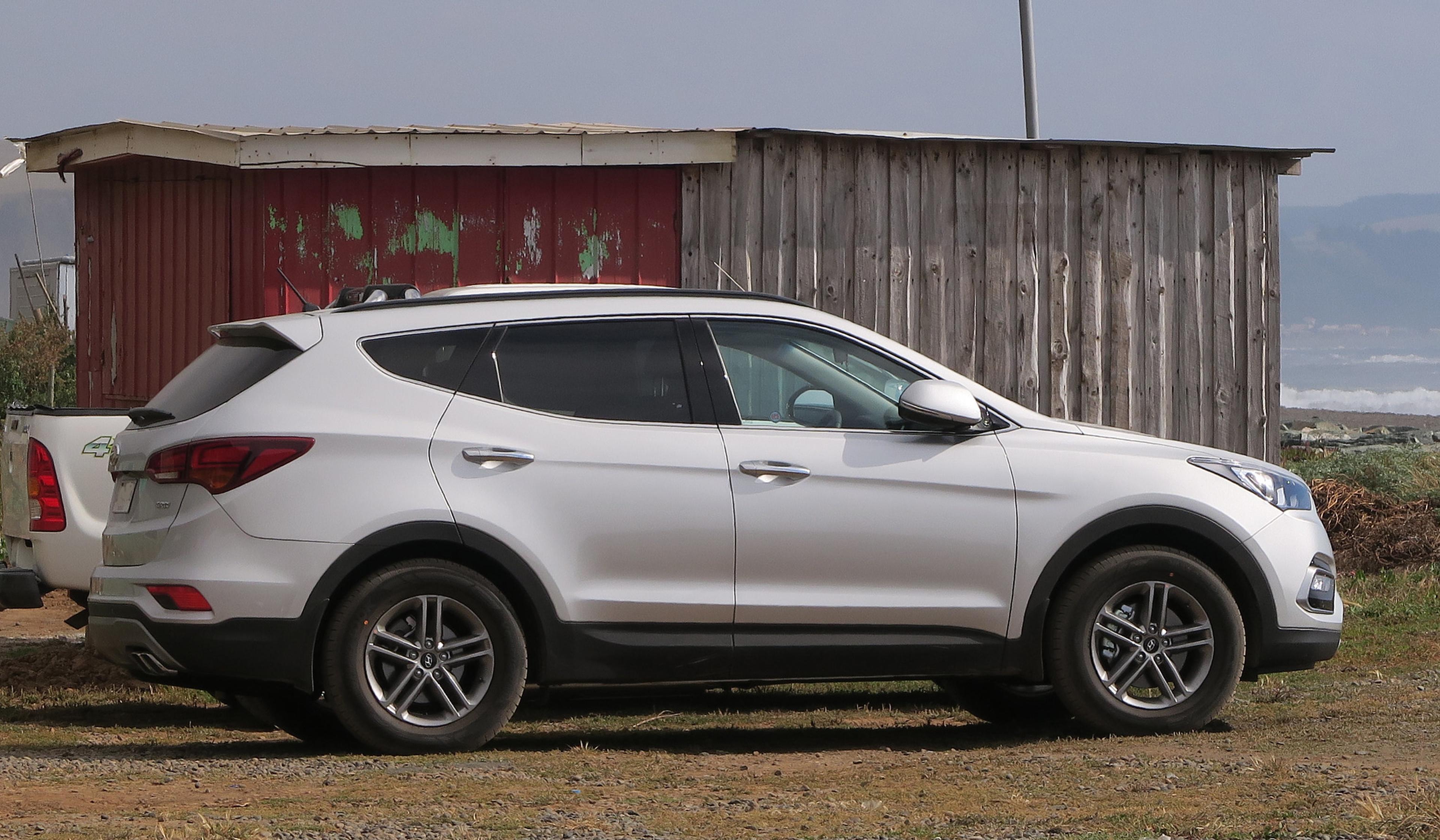 A white Hyundai Santa Fe  