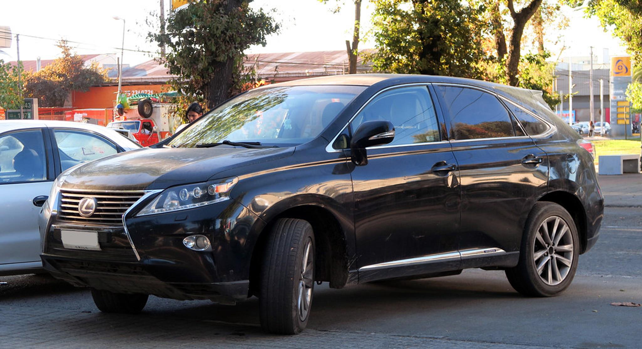 Black Lexus RX450h parked on asphalt
