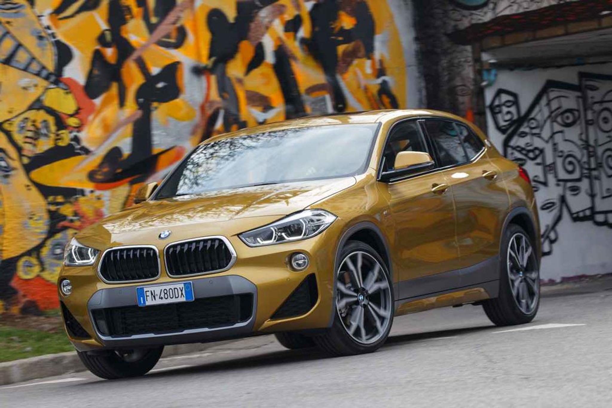 Gold BMW X2 moving