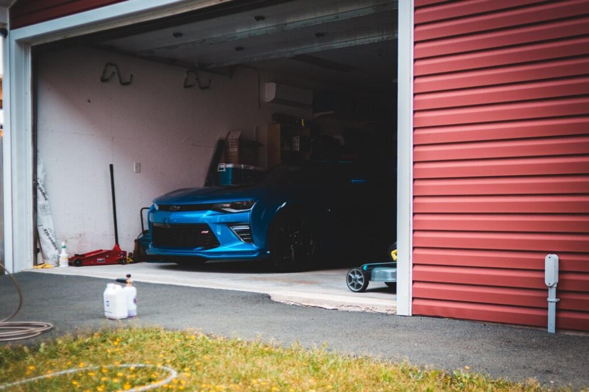 Dark blue car standing in a garage