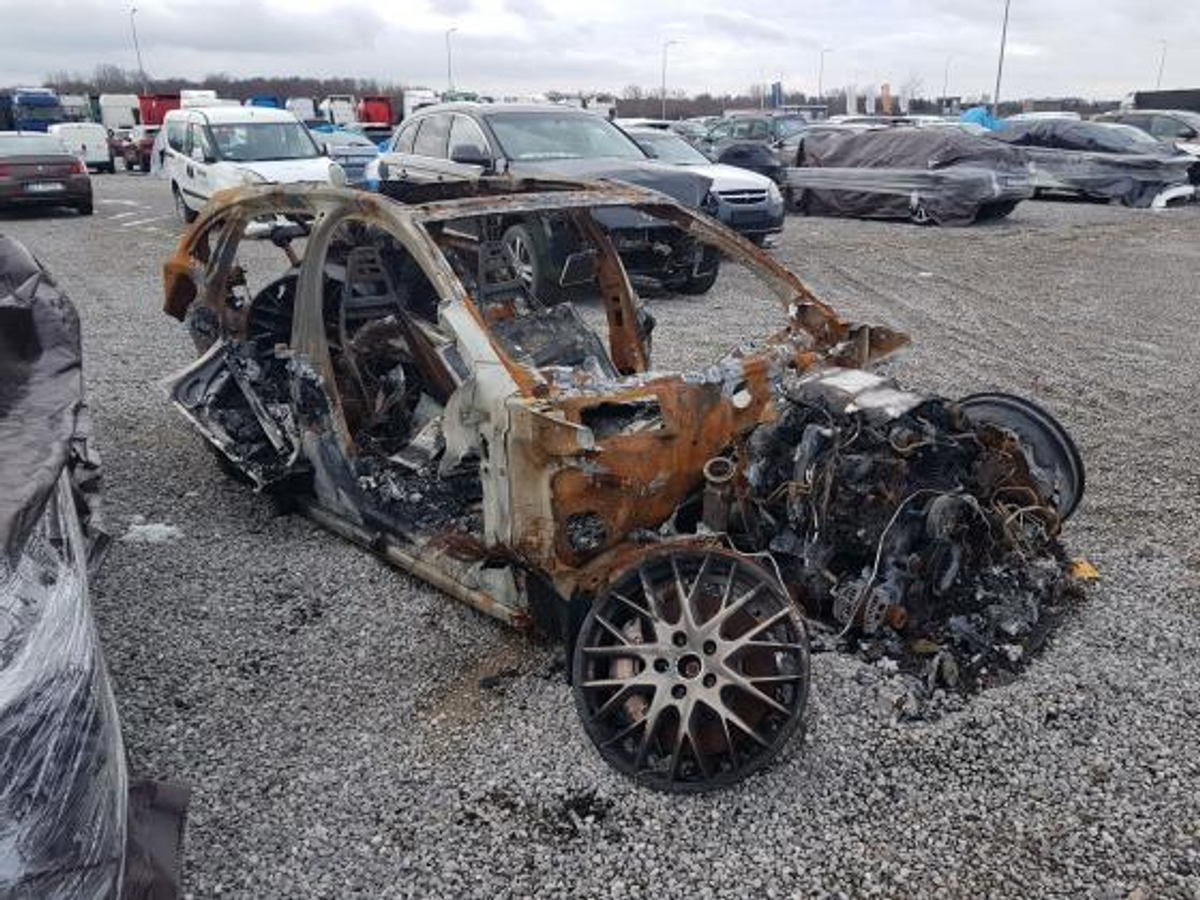 Photo from carVertical report showing a burned-down Porsche Panamera