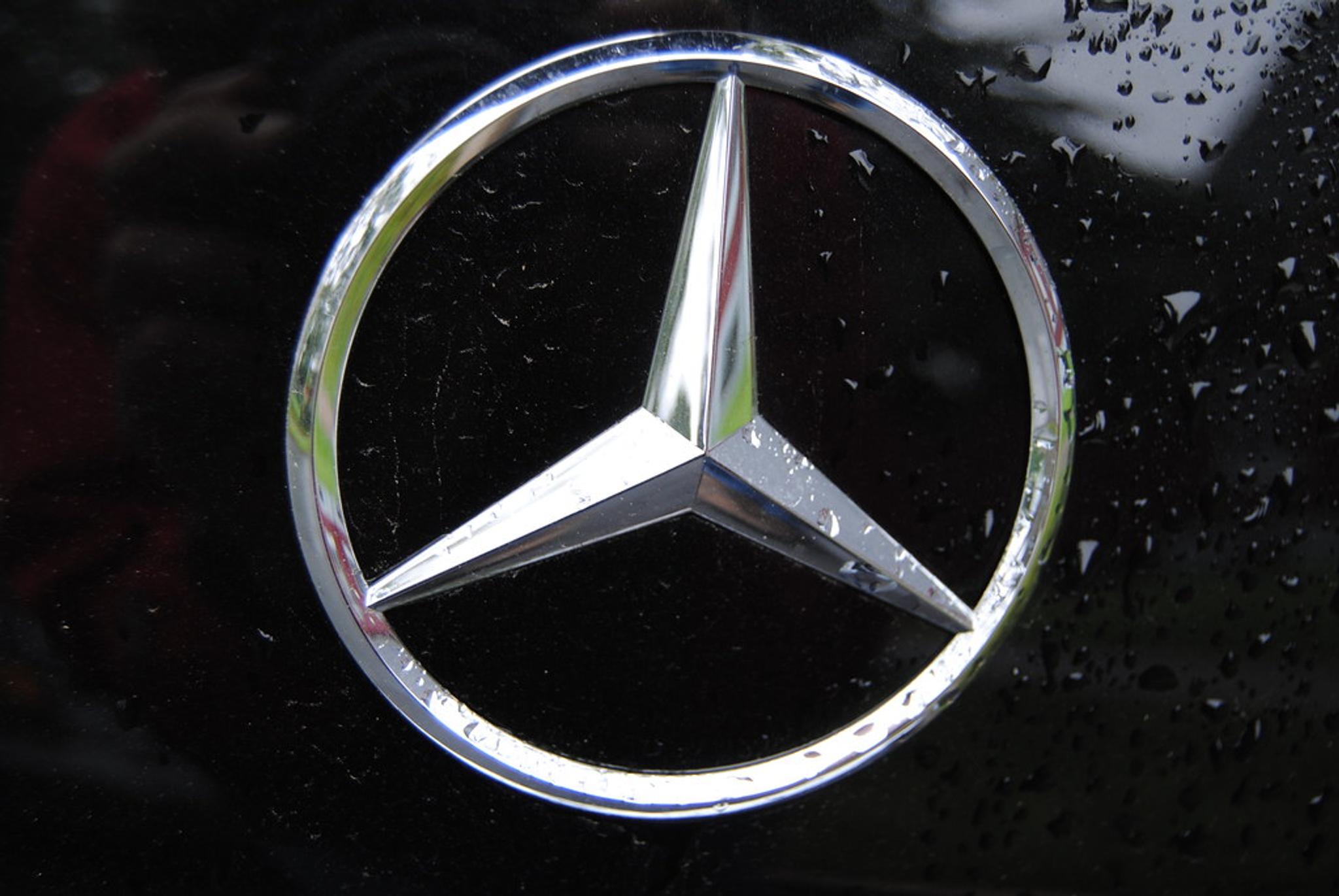 Mercedes badge on a black car