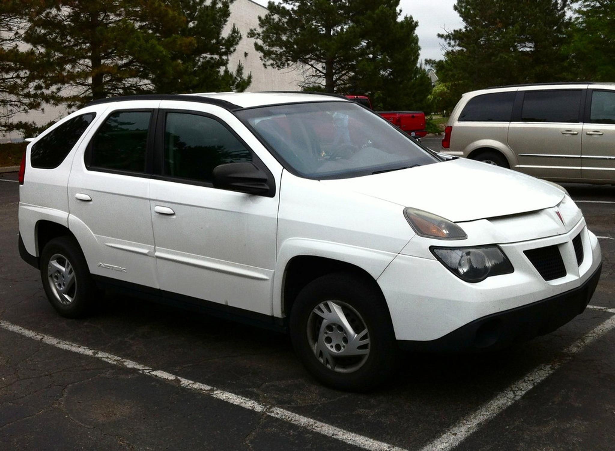 White Pontiac Aztek in the parking lot