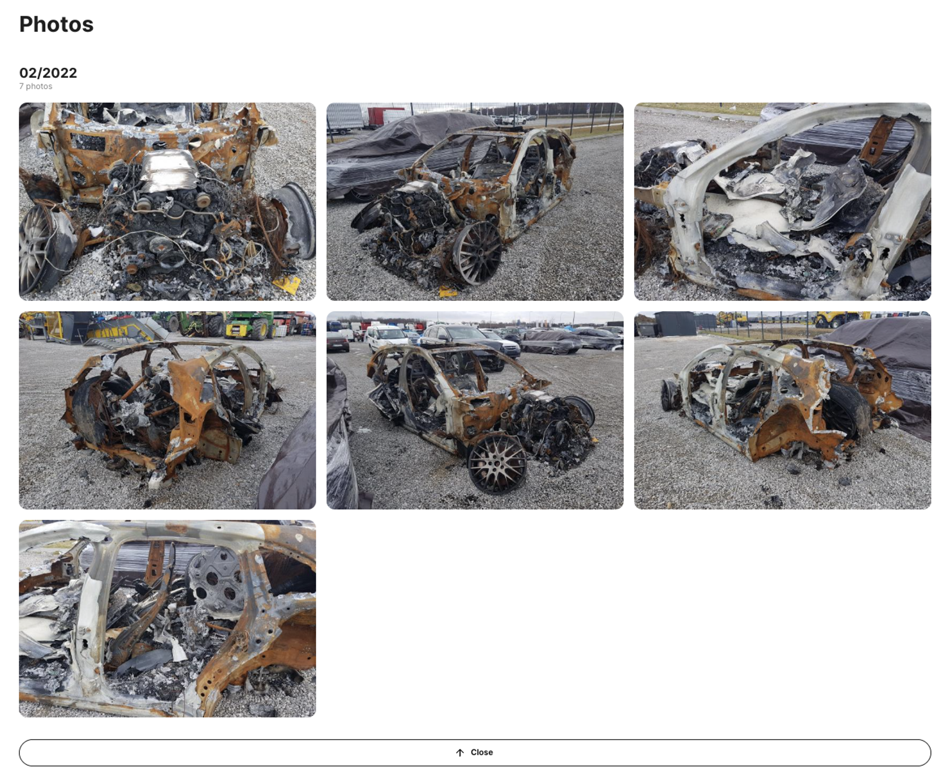Burned Porsche Panamera in the Photo section of the carVertical report