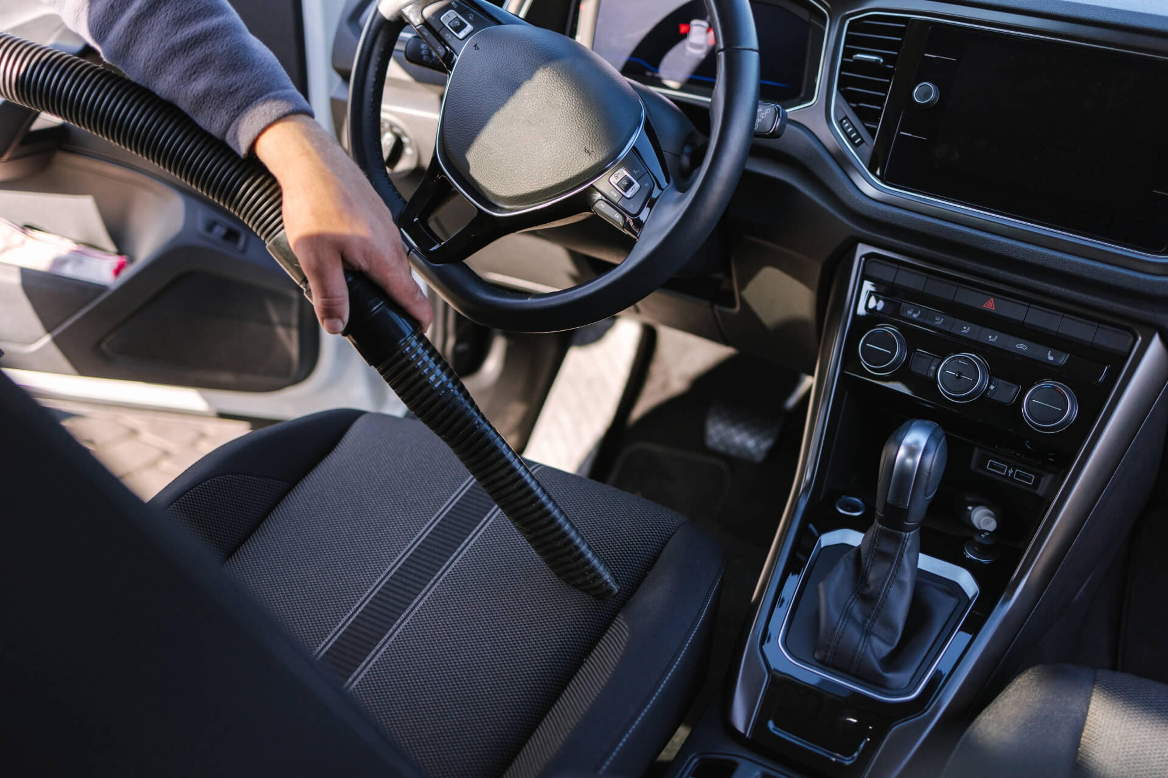 vacuuming car