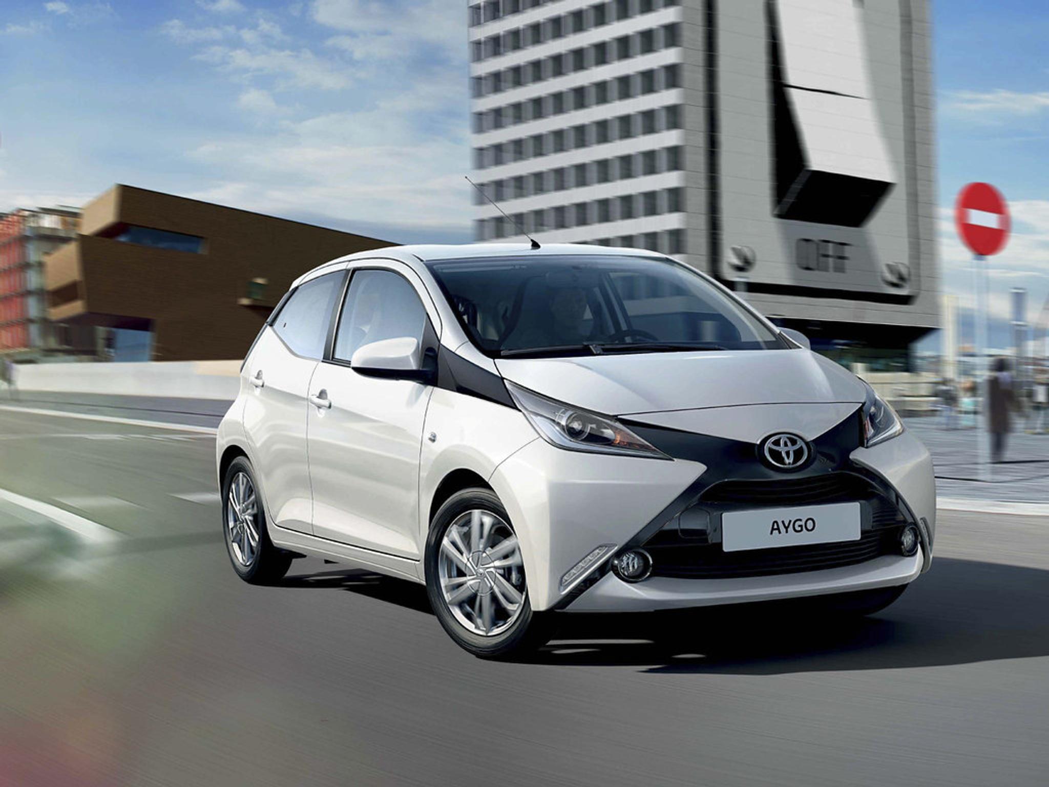 White Toyota Aygo driving