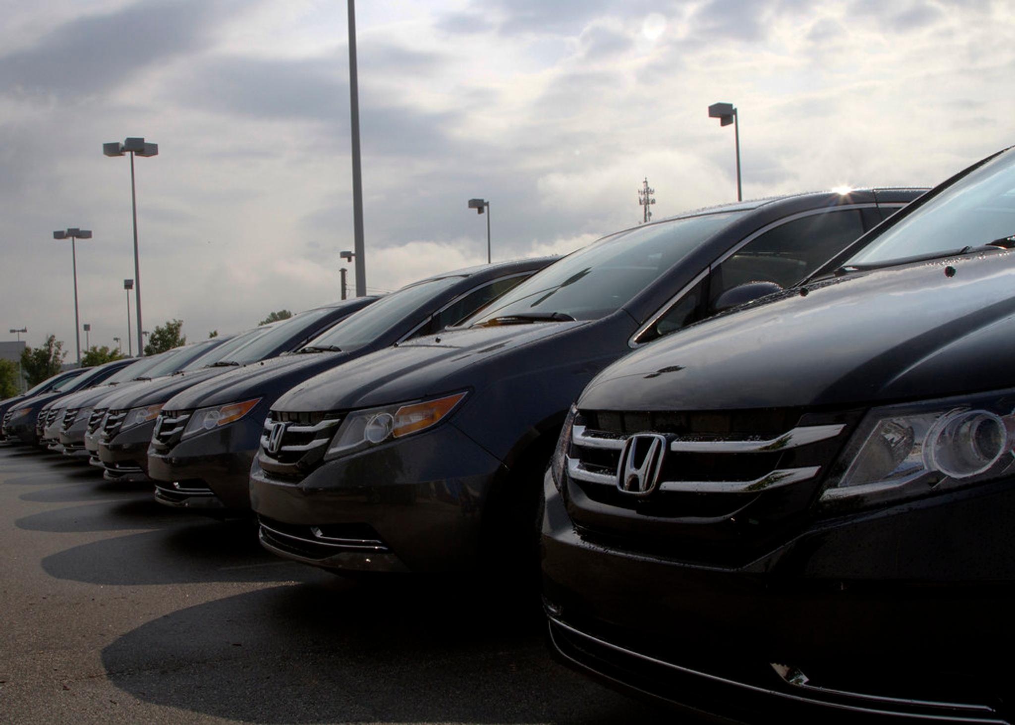 A row of Honda cars in a dealership