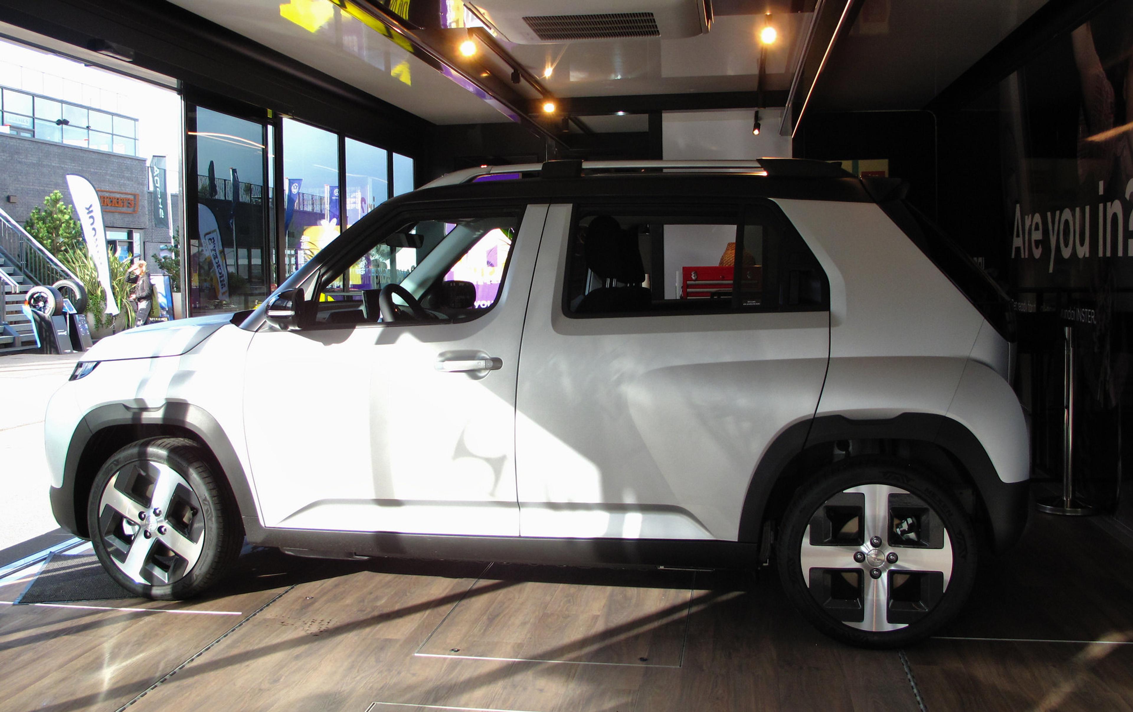 A white Hyundai Inster in a showroom