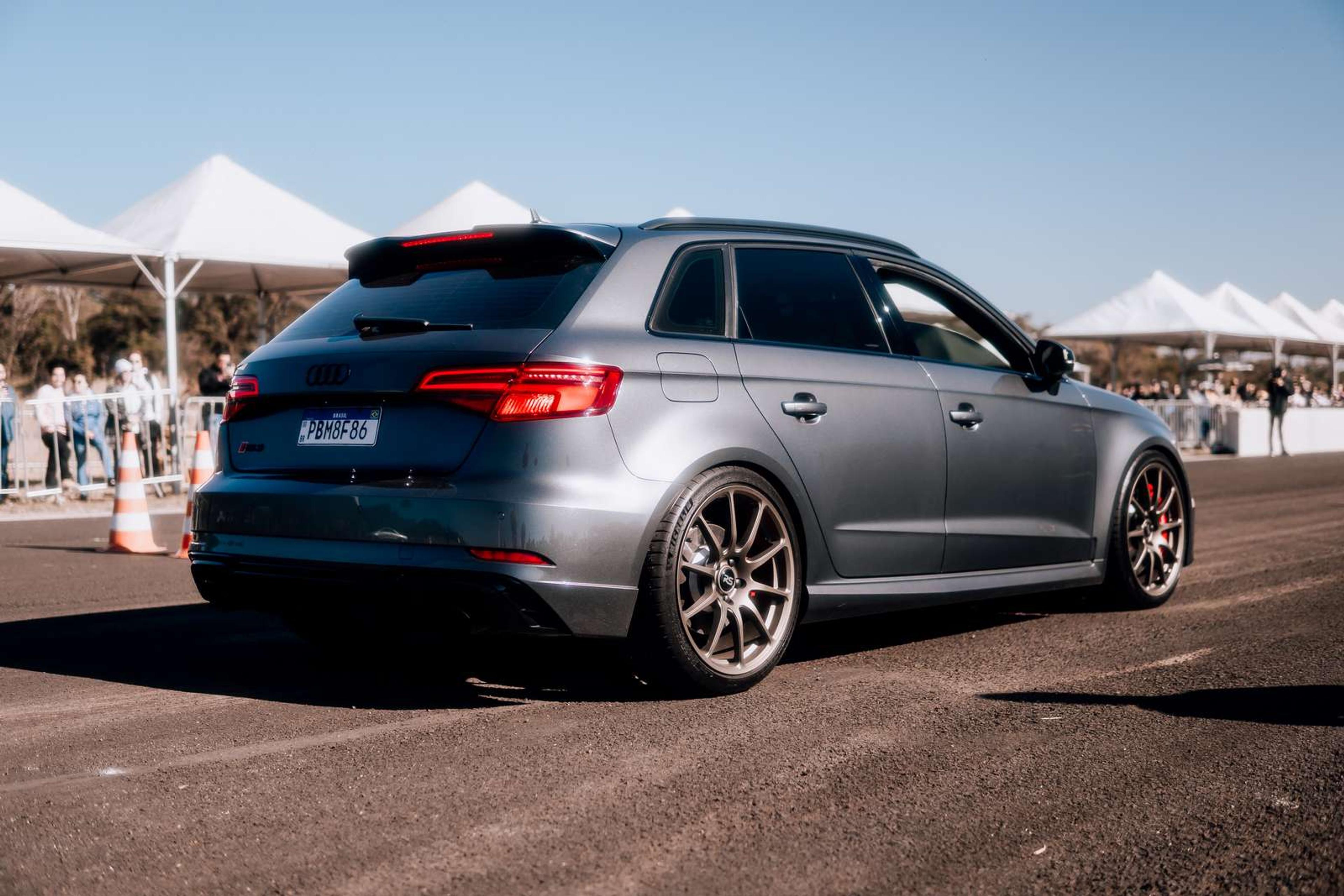 Grey Audi RS3 on a race track
