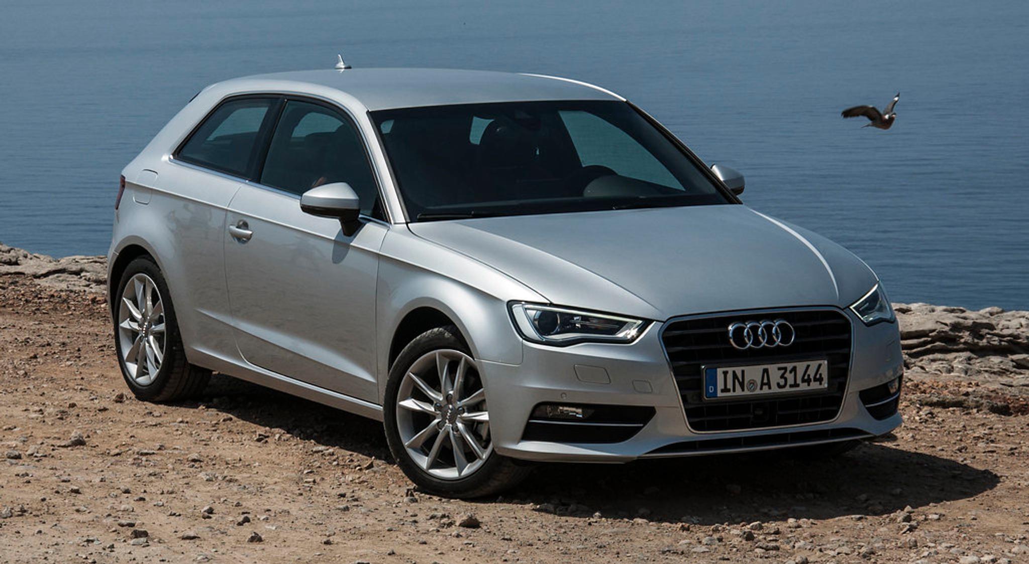 Silver Audi A3 next to the ocean