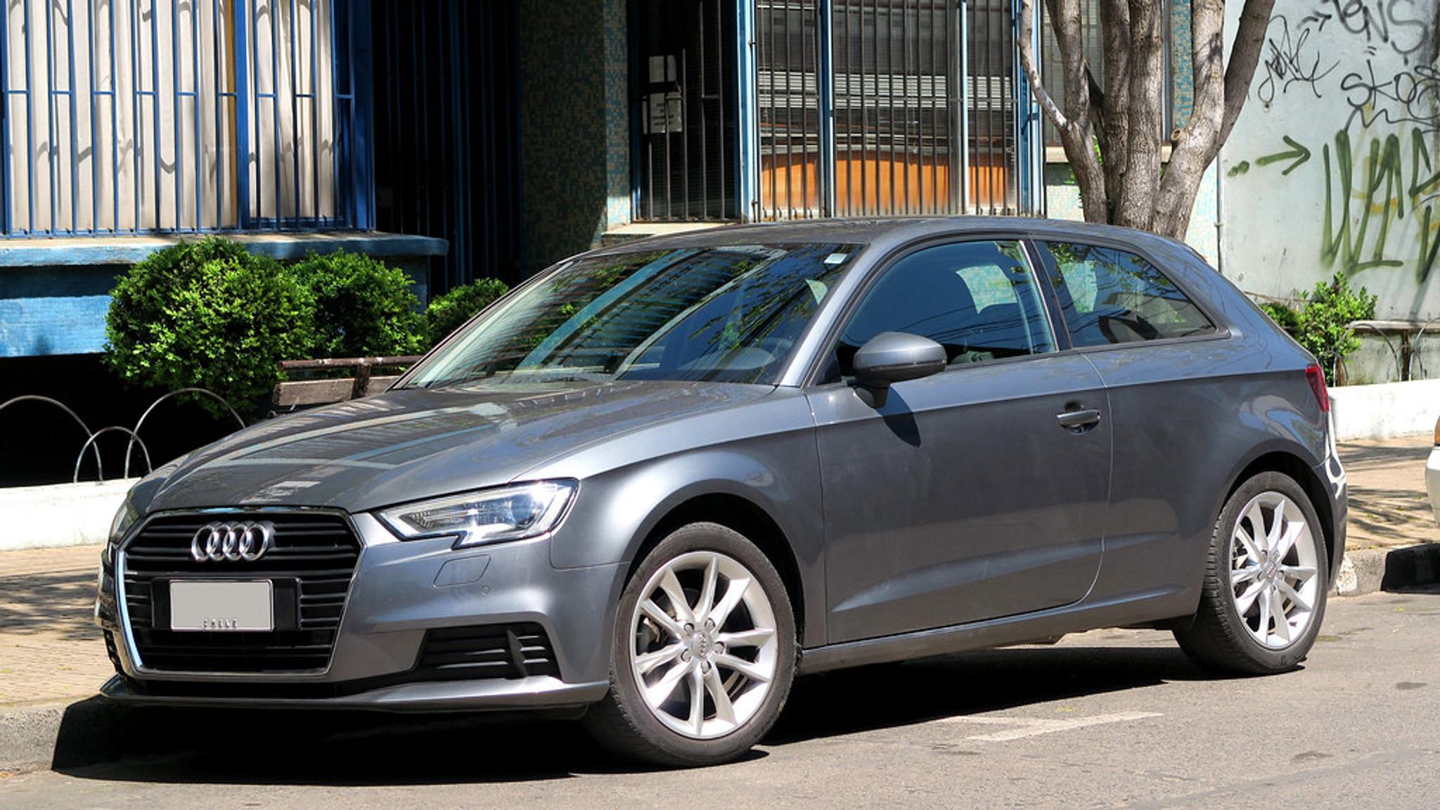 Grey Audi A4 two-door parked on the side of the road