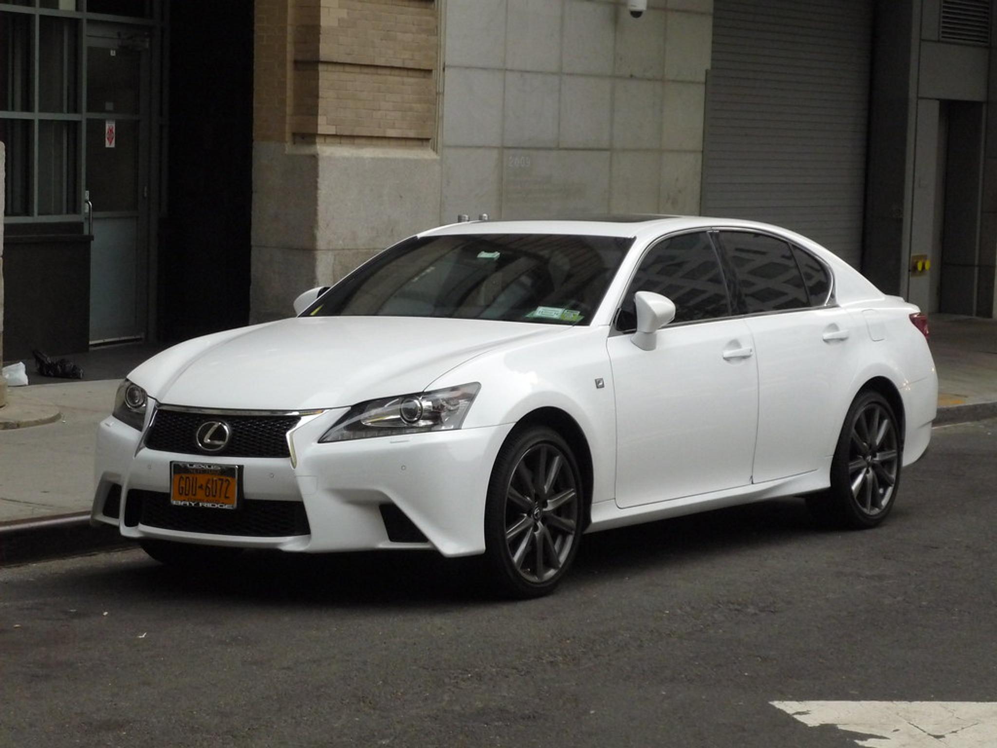 White Lexus GS parked by the side of the road