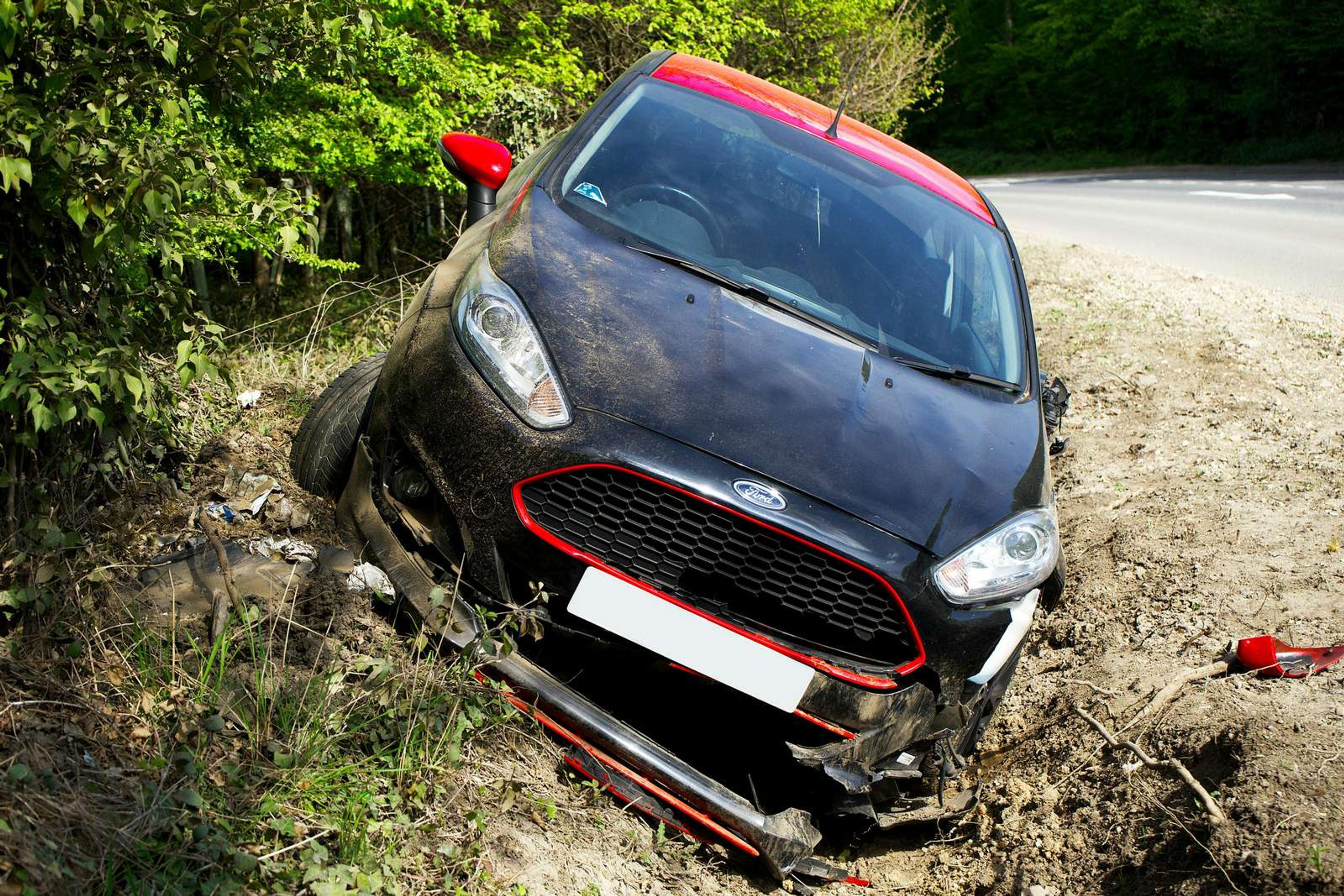 Compact hatchback in the ditch