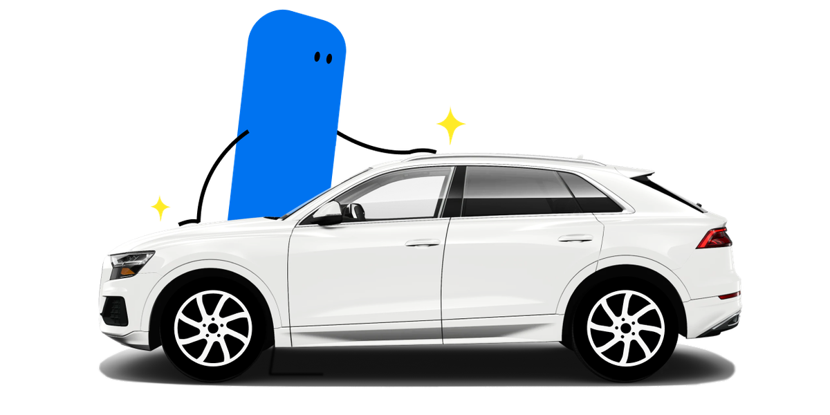 mascot next to a car