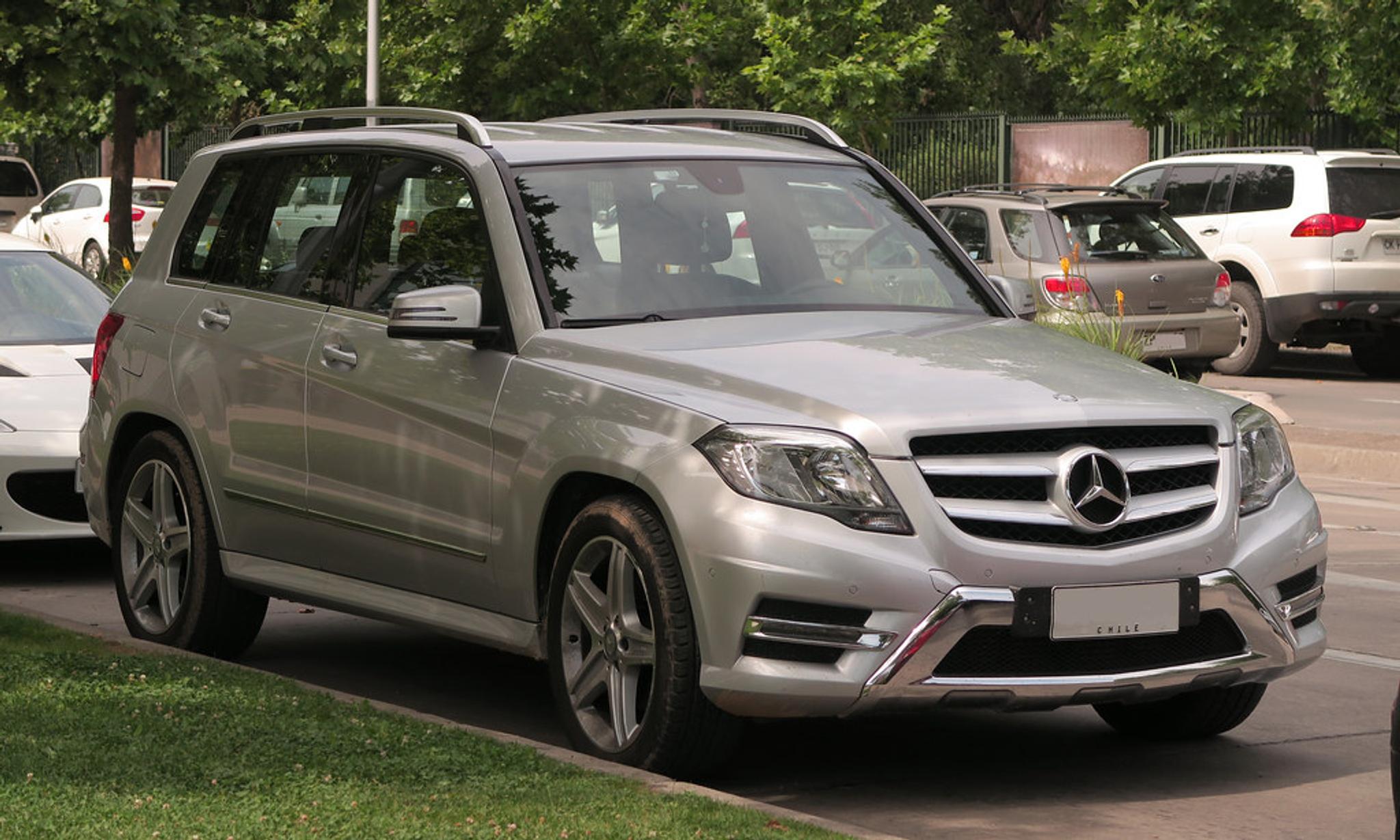 Silver Mercedes GLK parked on the side of the road