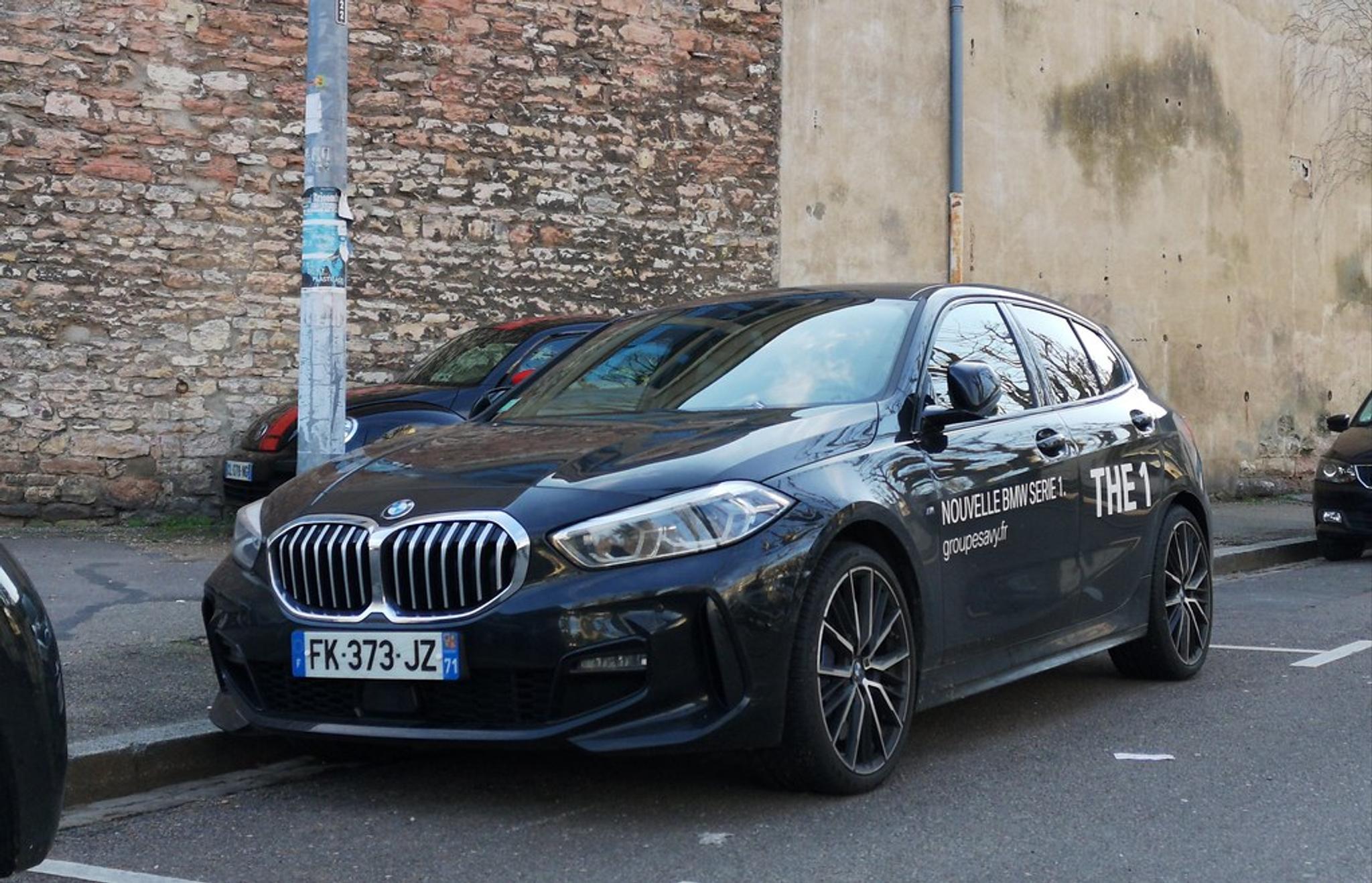 Dark blue BMW 1 Series on the street